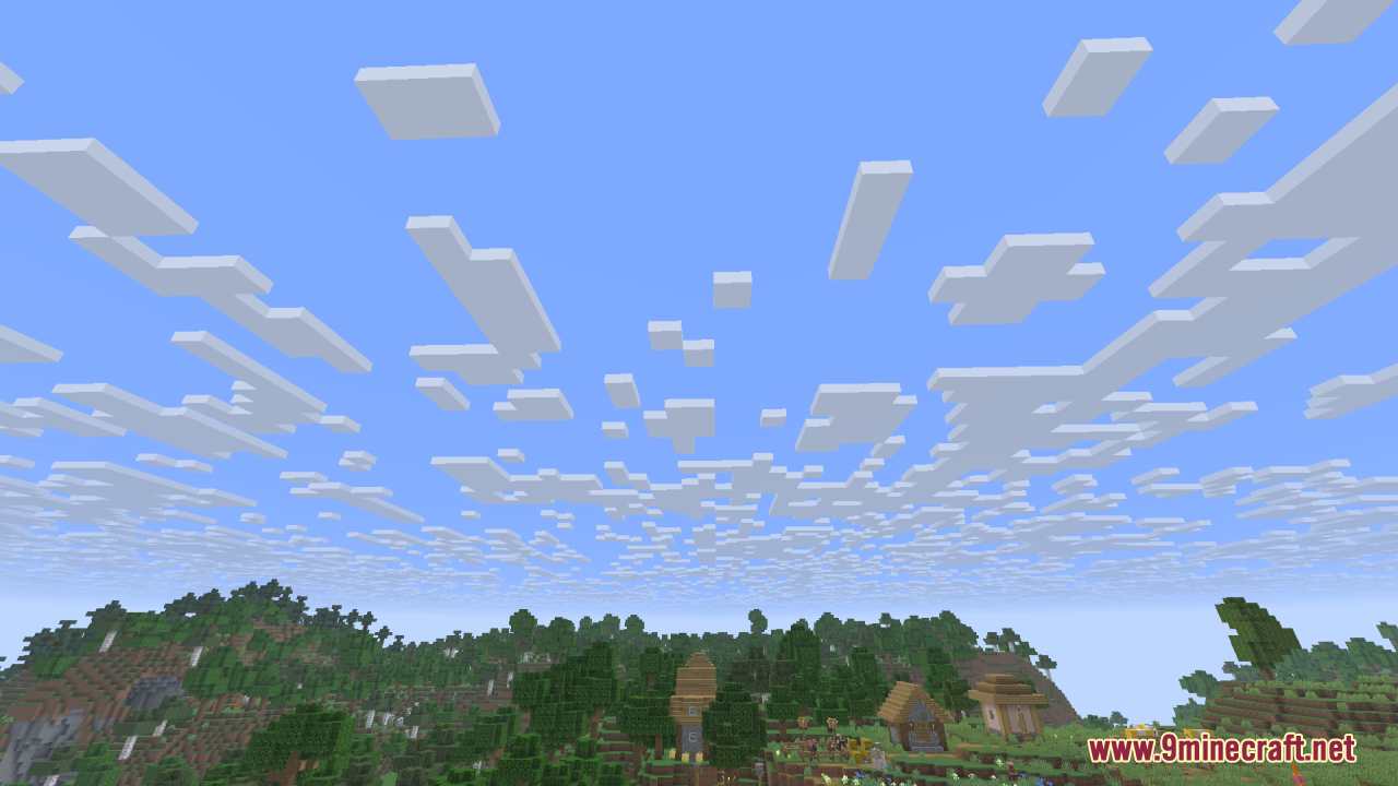 Scattered blocky clouds floating above a small village and forest landscape
