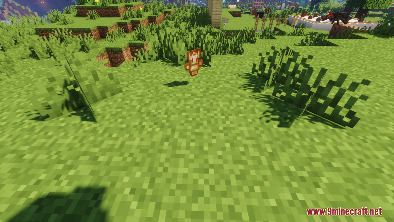 A dropped Technoblade totem item floating above the grassy ground