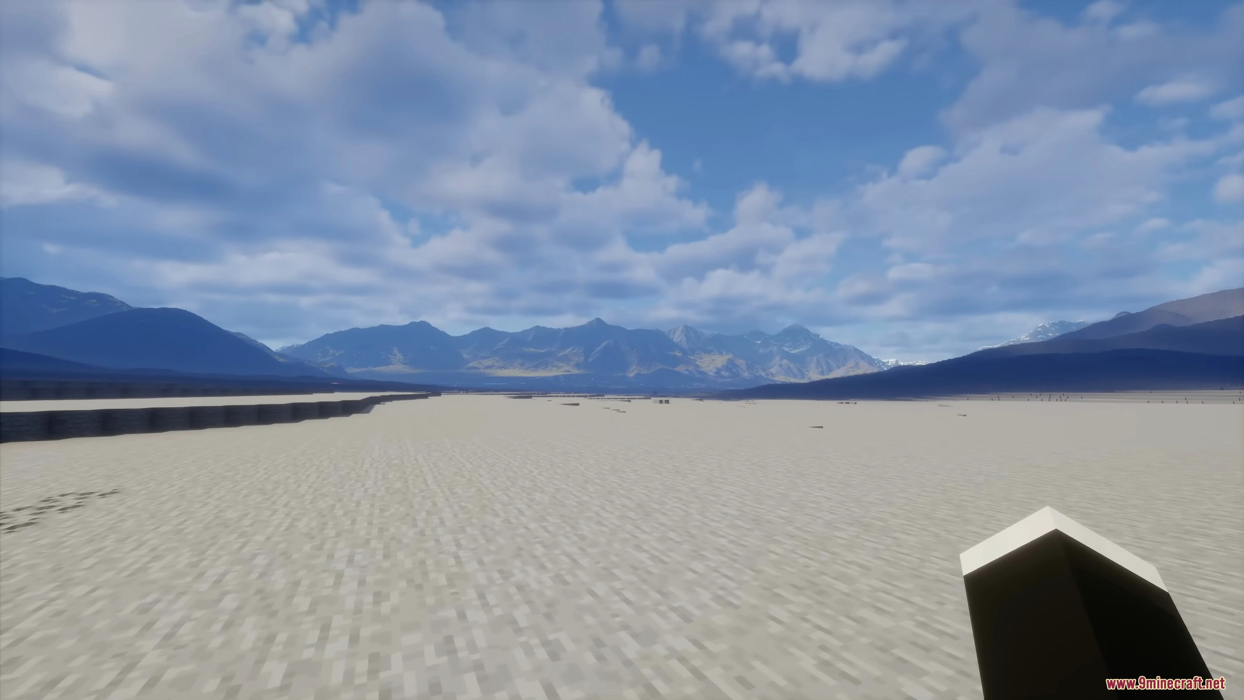 Expansive desert landscape with distant mountain ranges