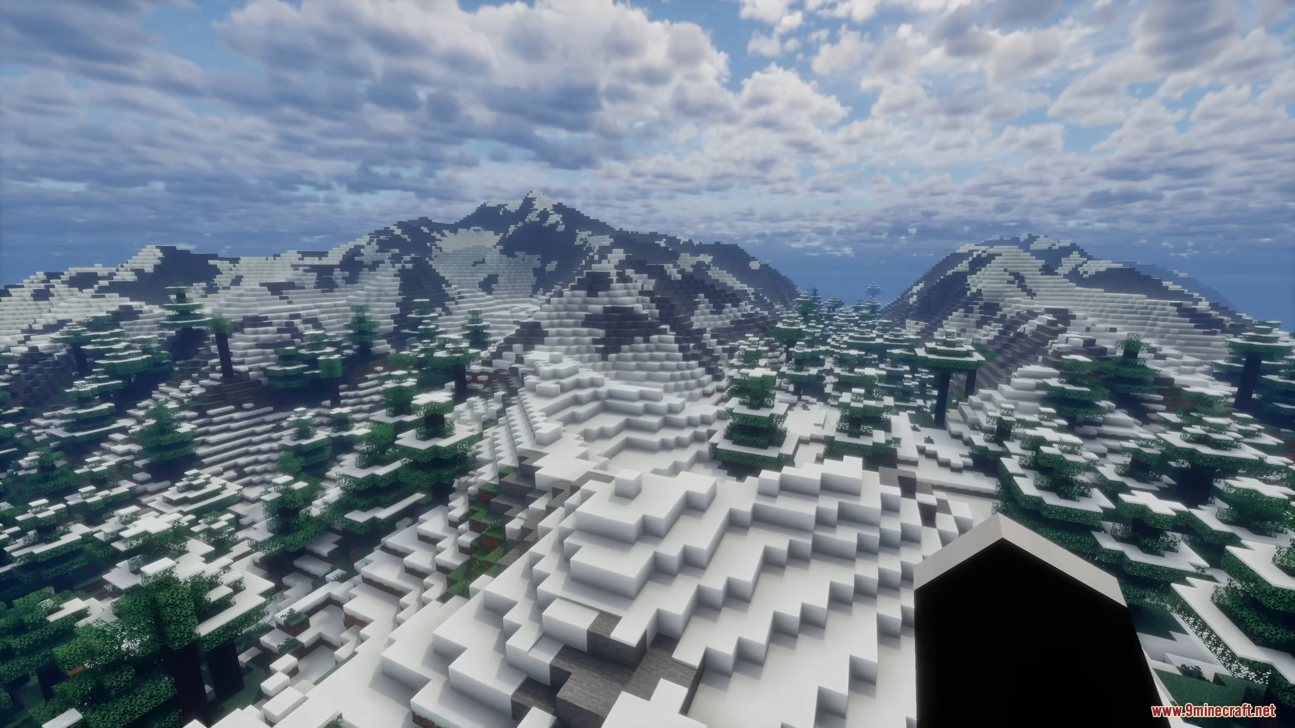 High altitude view of snow covered mountain ranges