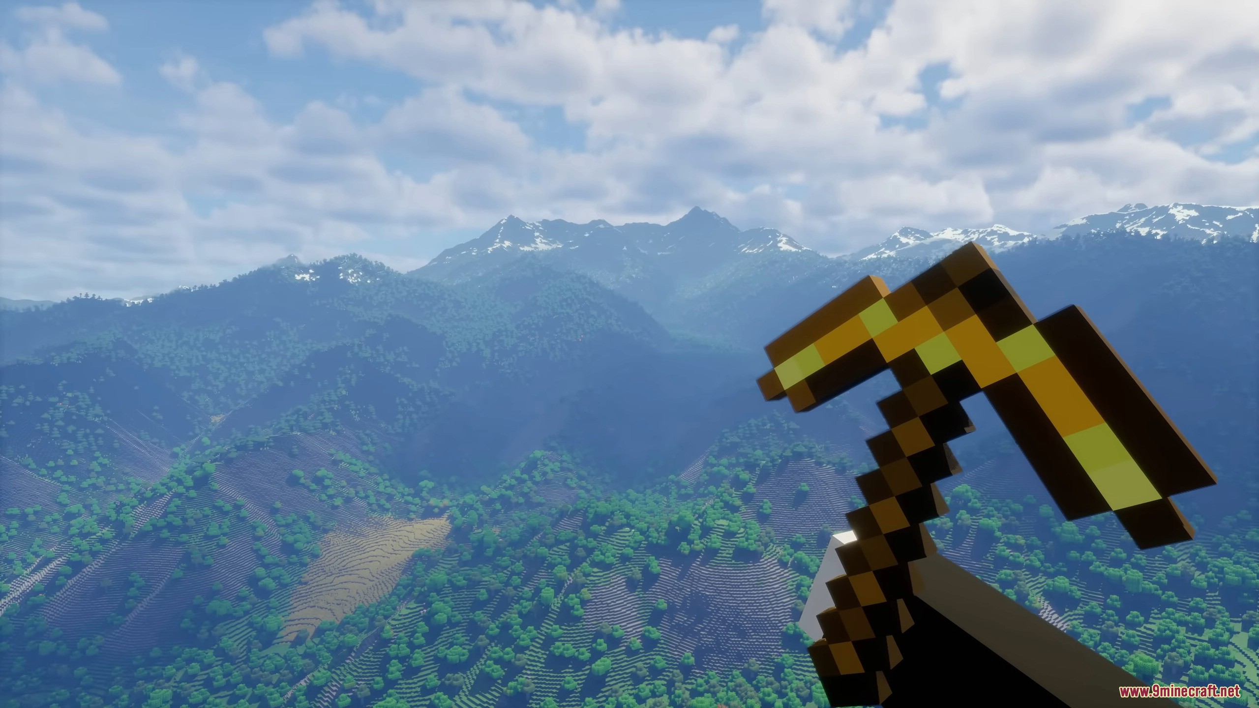 Player holding pickaxe overlooking expansive mountain terrain
