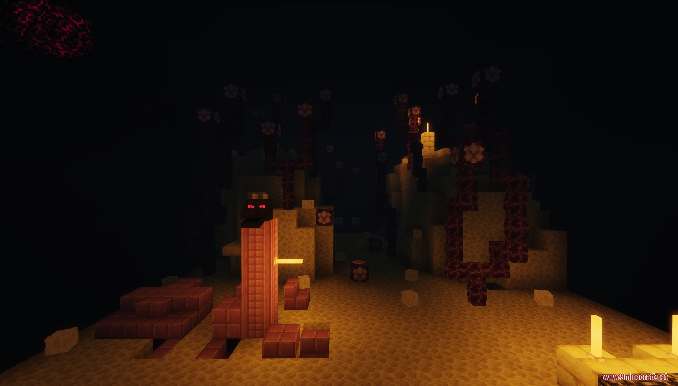 A red block creature in a dark, sandy area