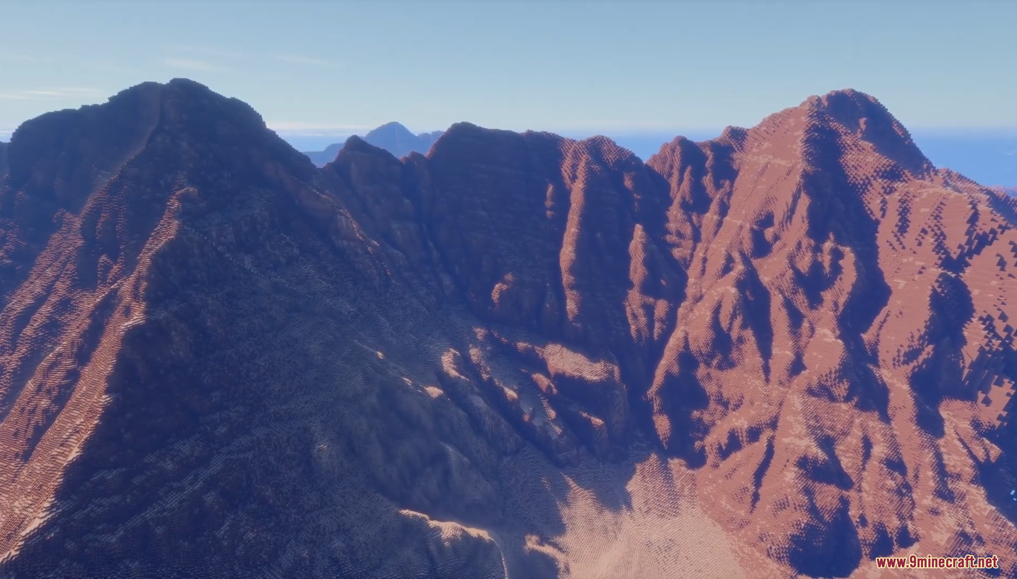 Close up view of steep jagged reddish mountain peaks and ridges