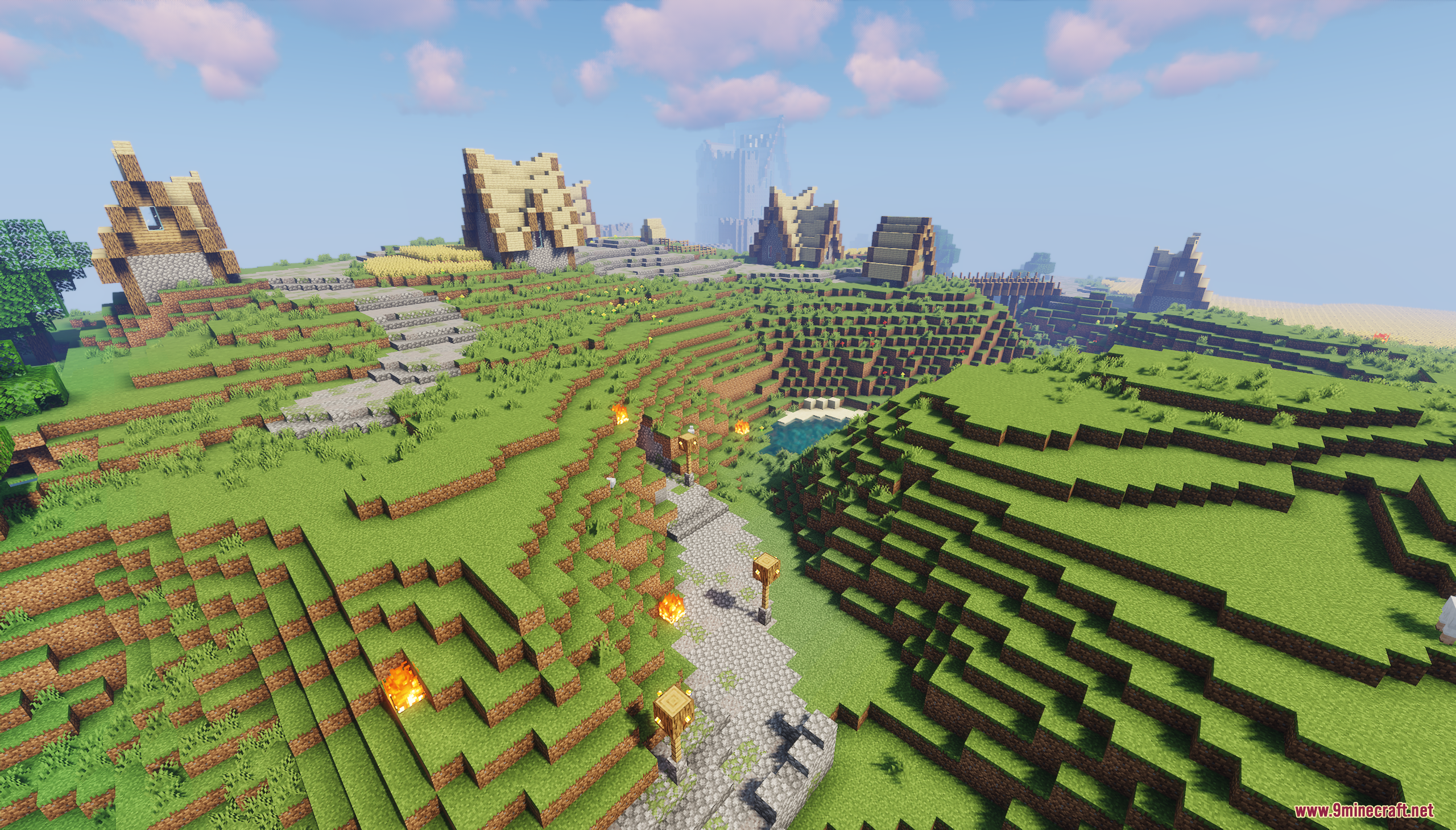 A medieval village built on rolling green hills