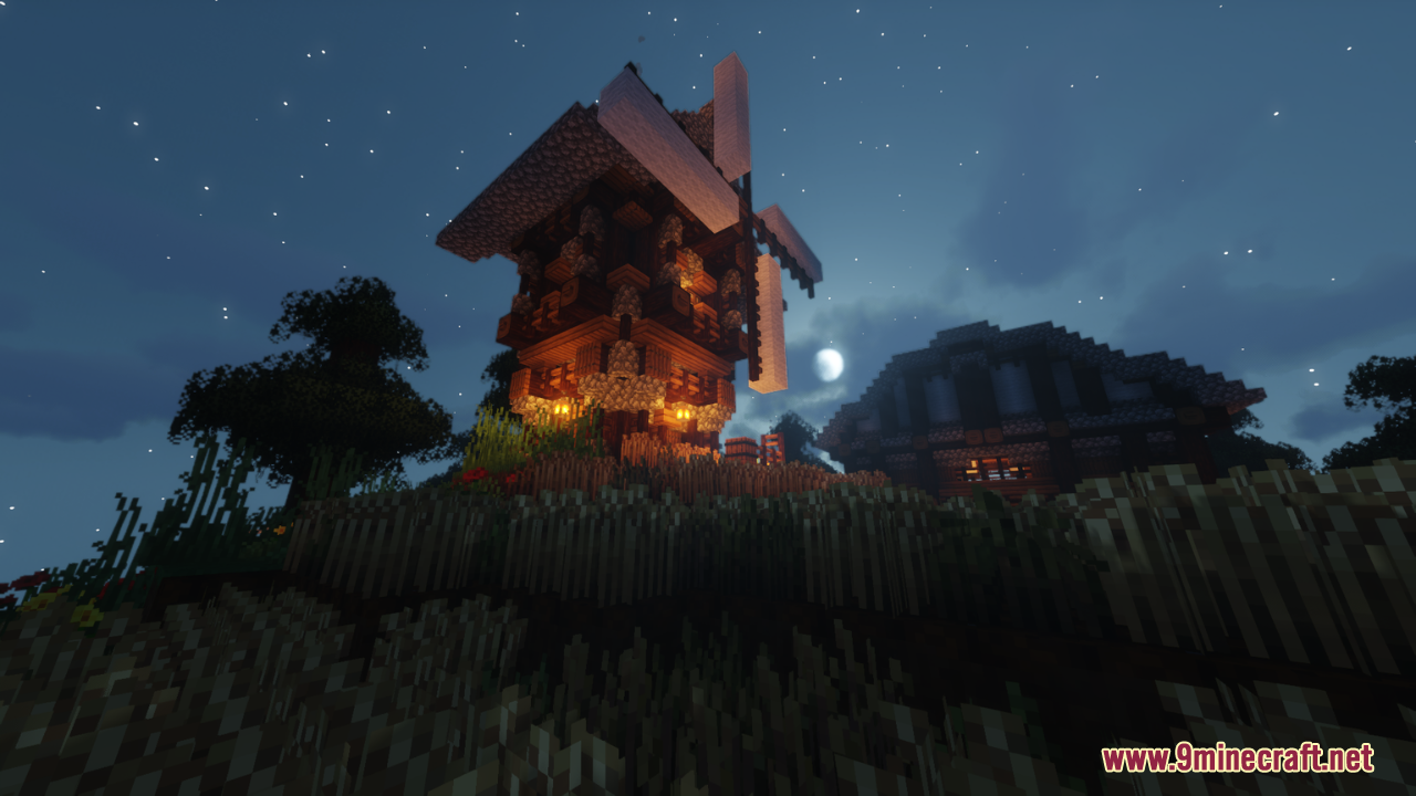 Minecraft windmill and house illuminated at night using Vibrancy Pack