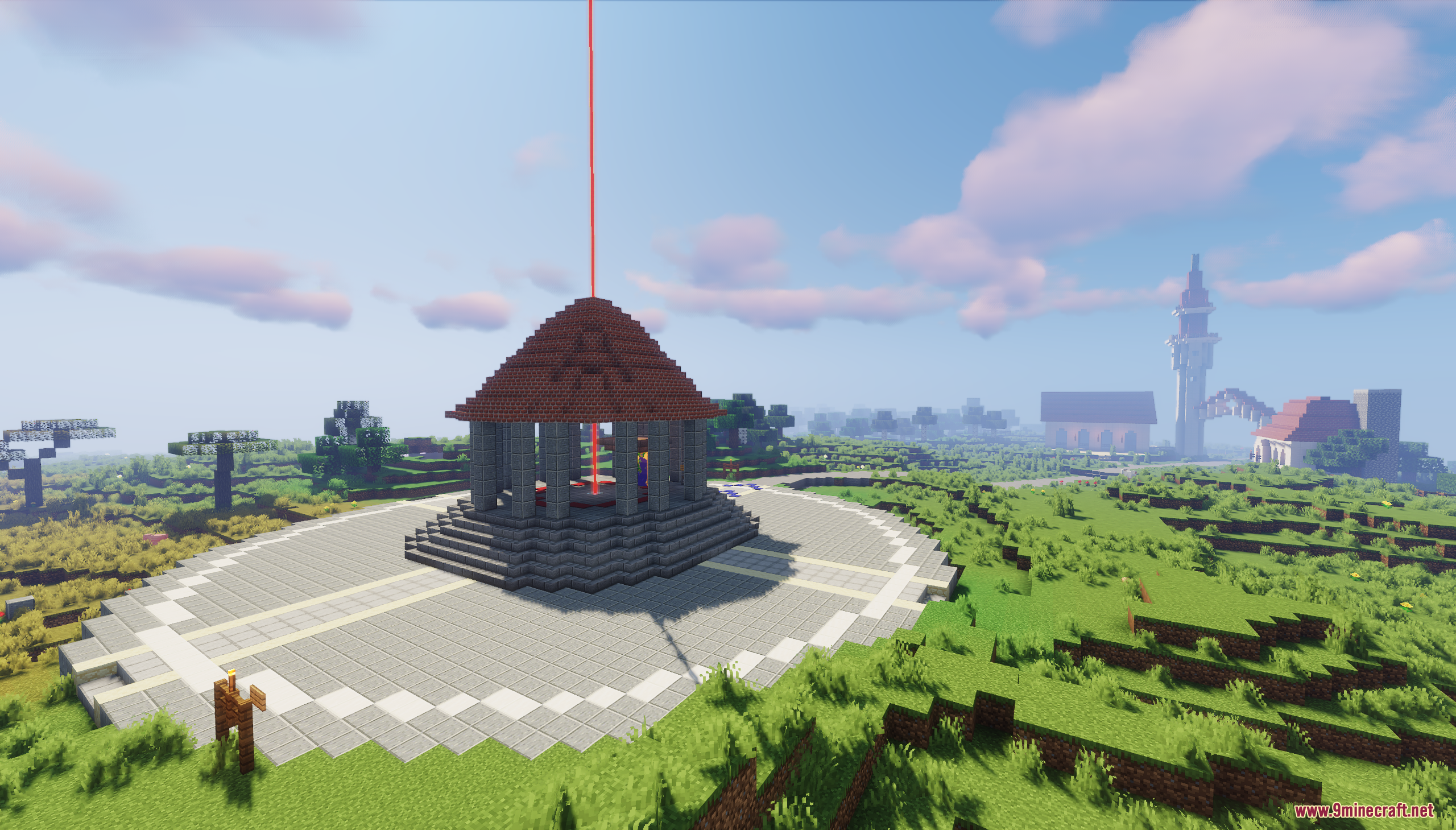 A central plaza with a gazebo and a red beacon