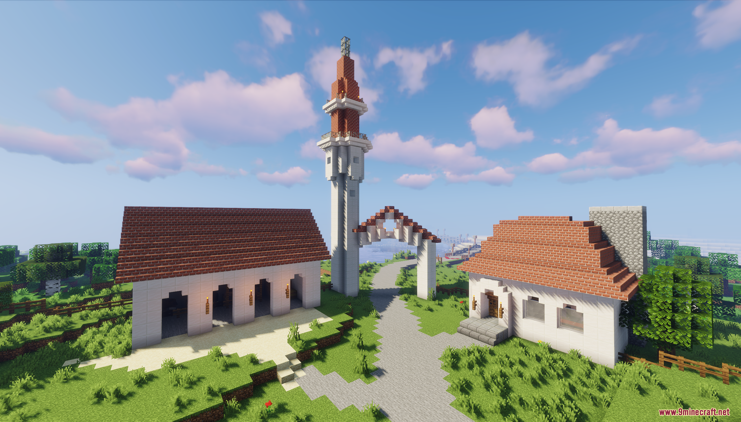 Village houses and a tall tower under a blue sky