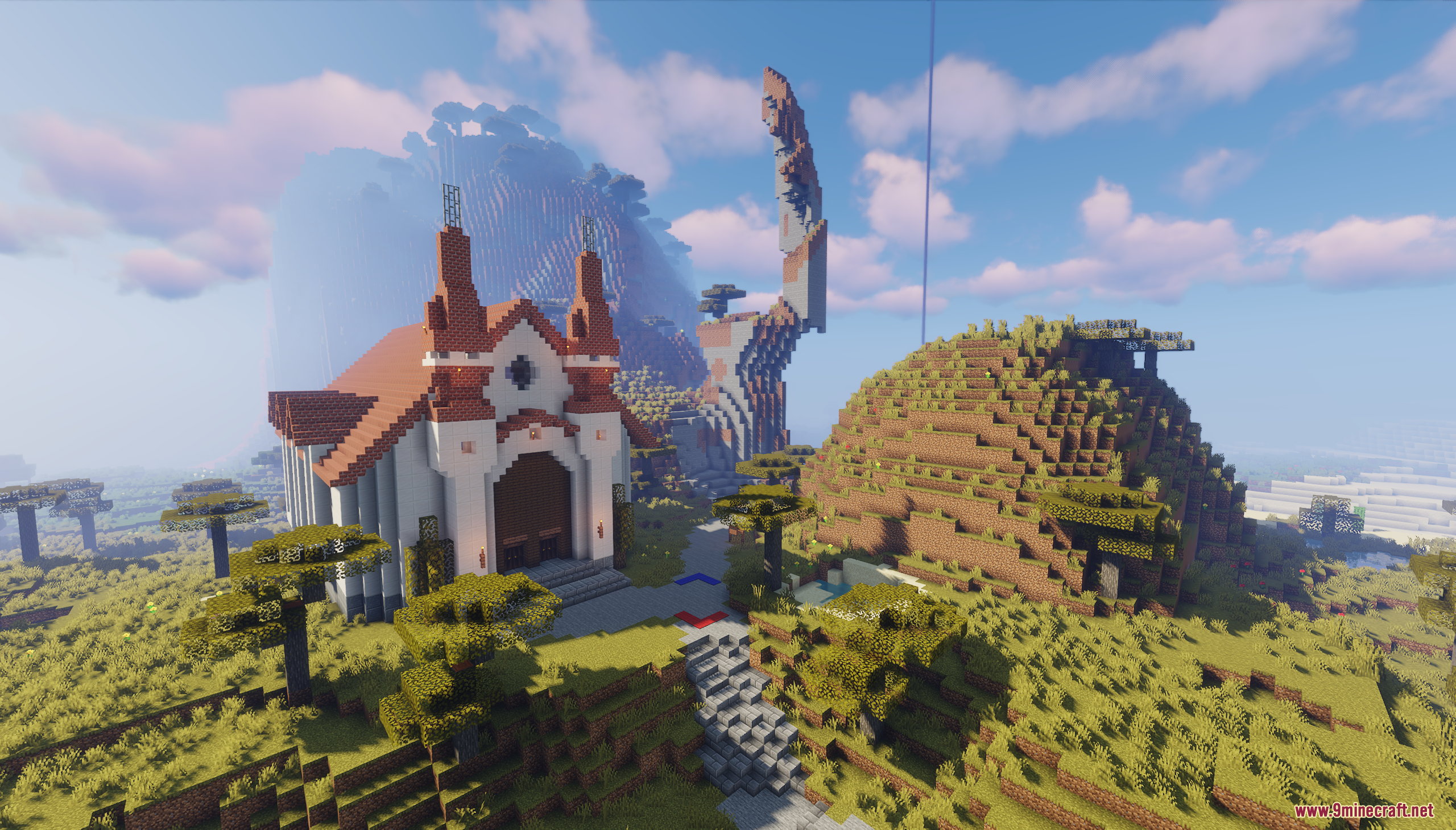 A white and red church in a vast landscape