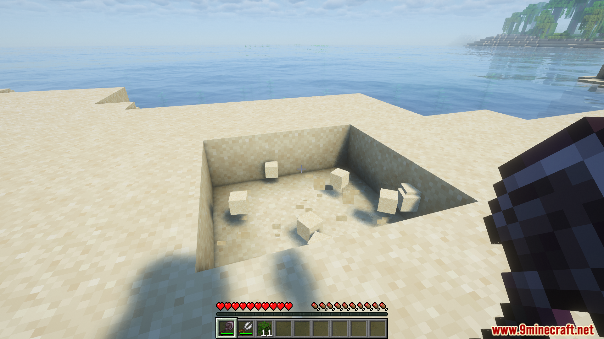 Excavator breaking nine sand blocks at once dropping them as items