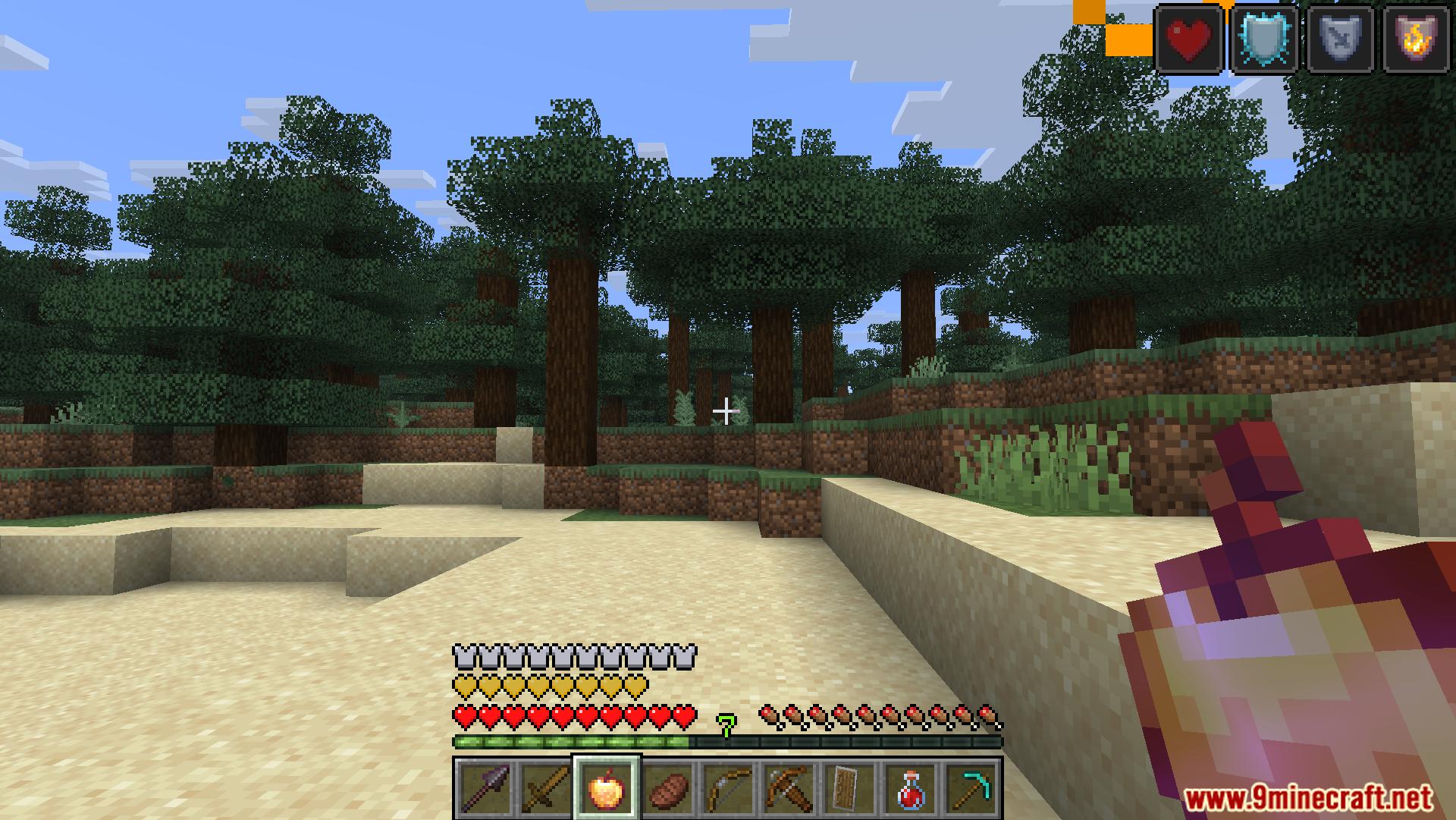 Player holding a golden apple with active status effects displayed