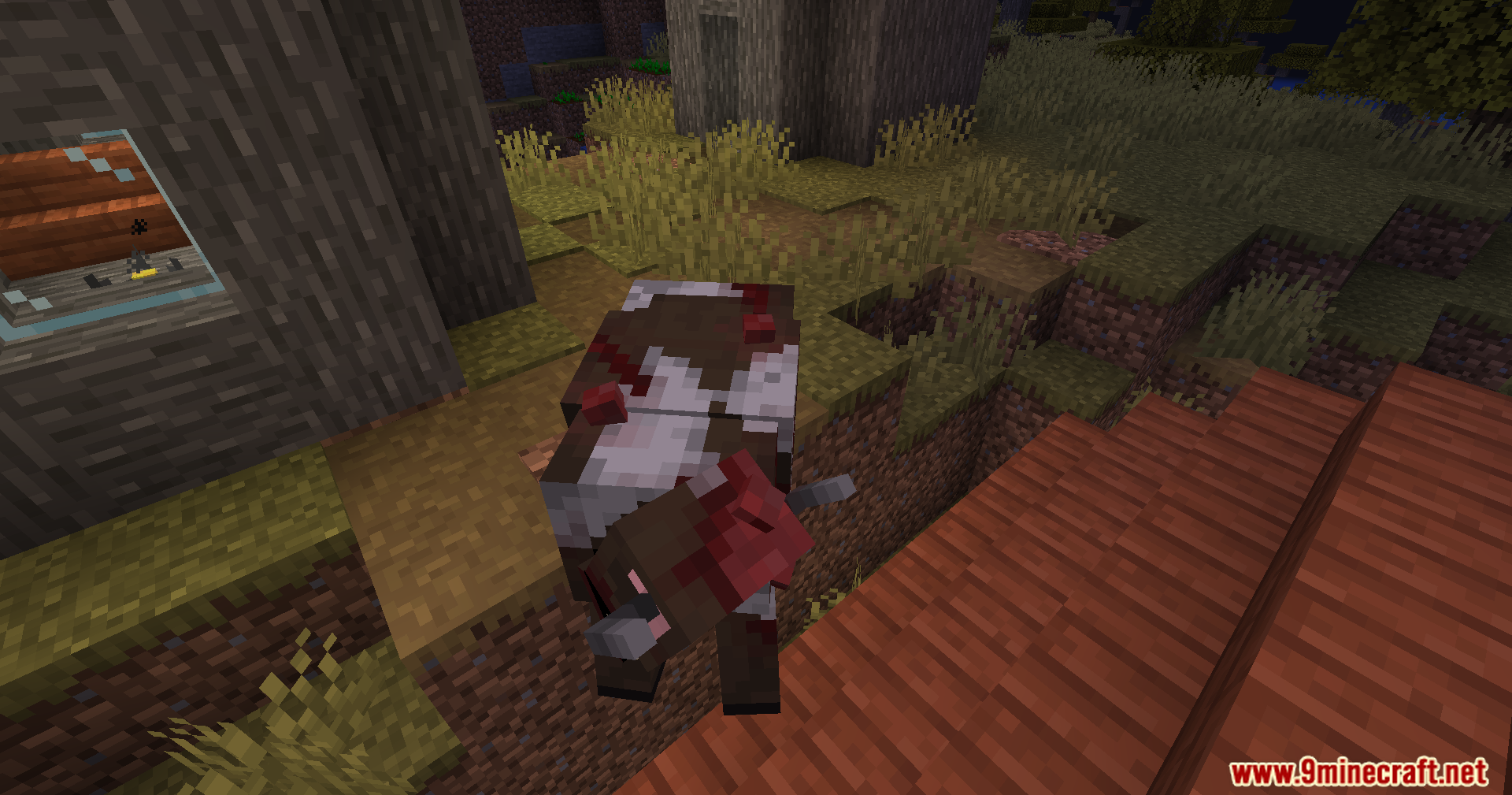 Bloody infected cow near wooden structures in Ultimate Zombie Apocalypse Mod