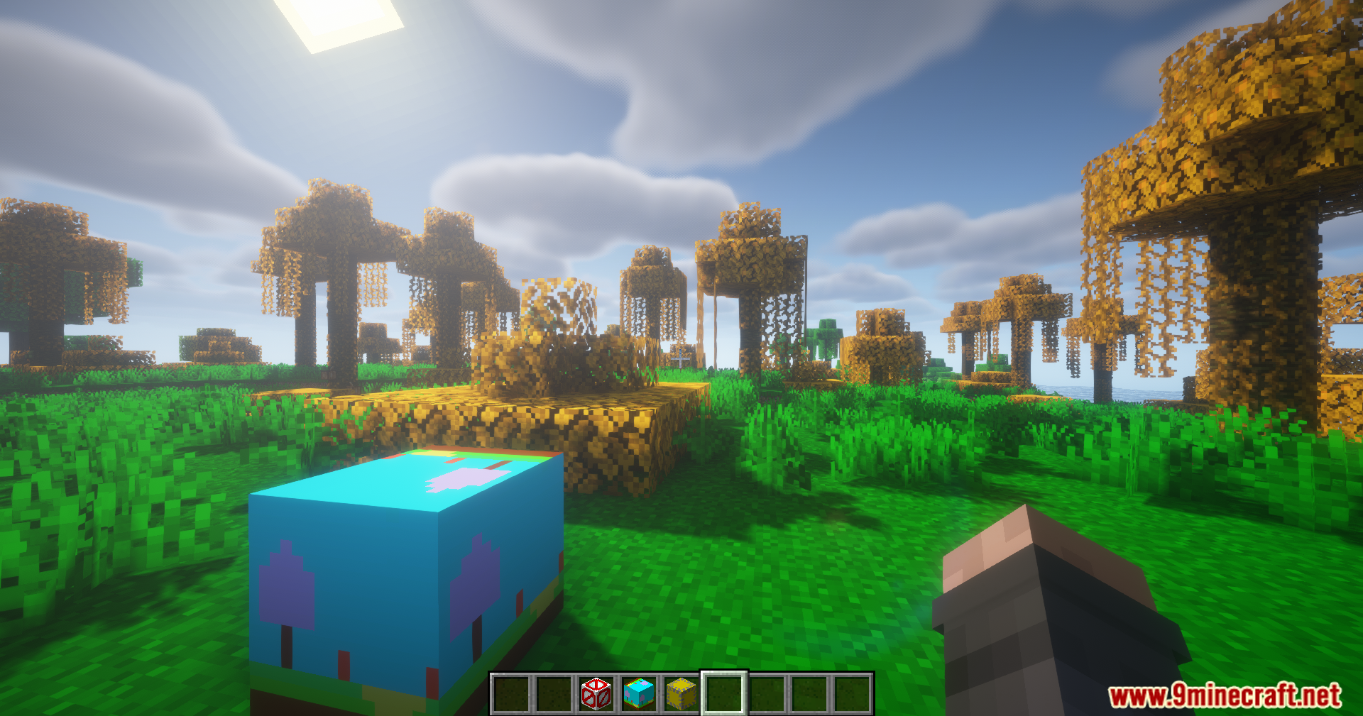 Weather Gate Mod Screenshot 11 Player holding a block near trees with bright orange leaves