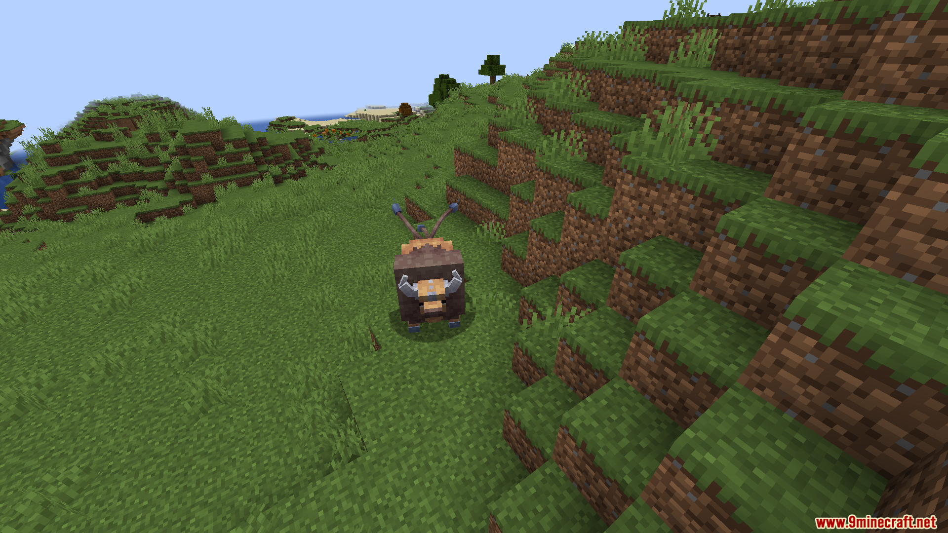 Wild Tauros Pokemon standing alone on a grassy Minecraft hillside