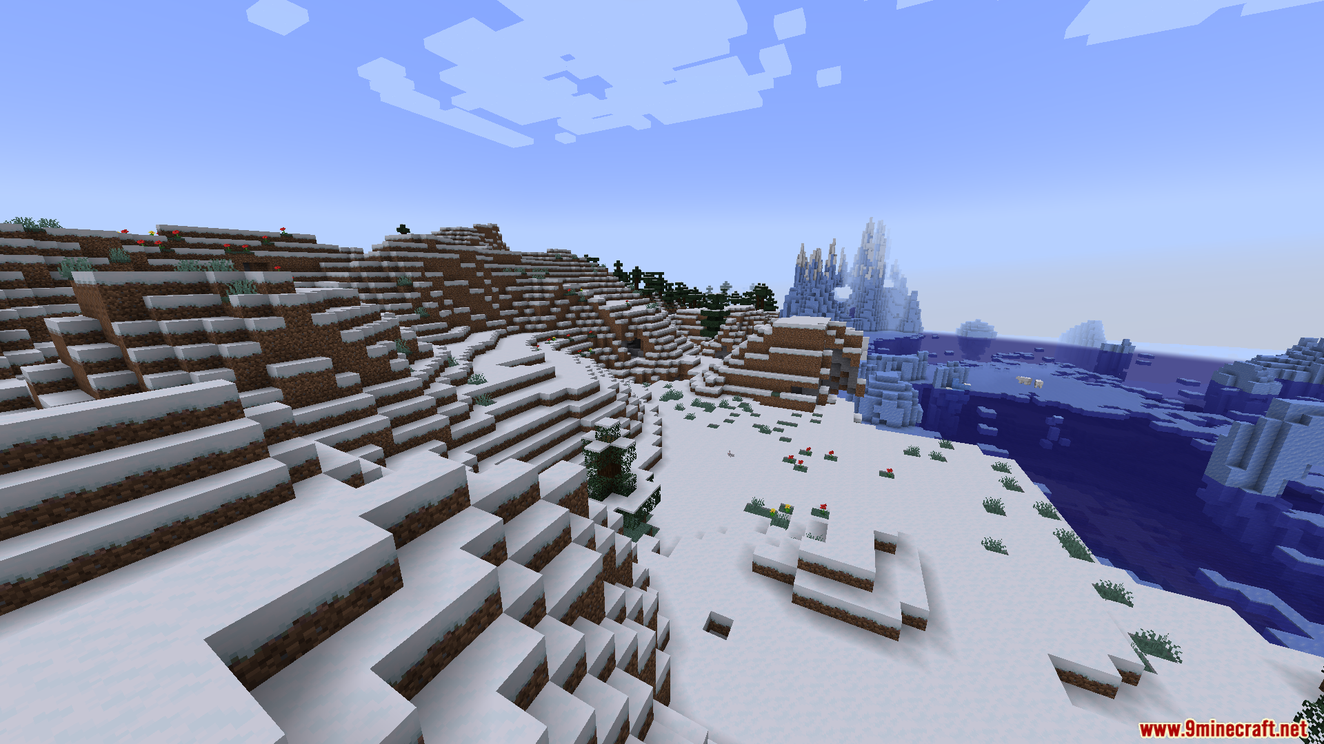 A snowy landscape with hills and frozen terrain