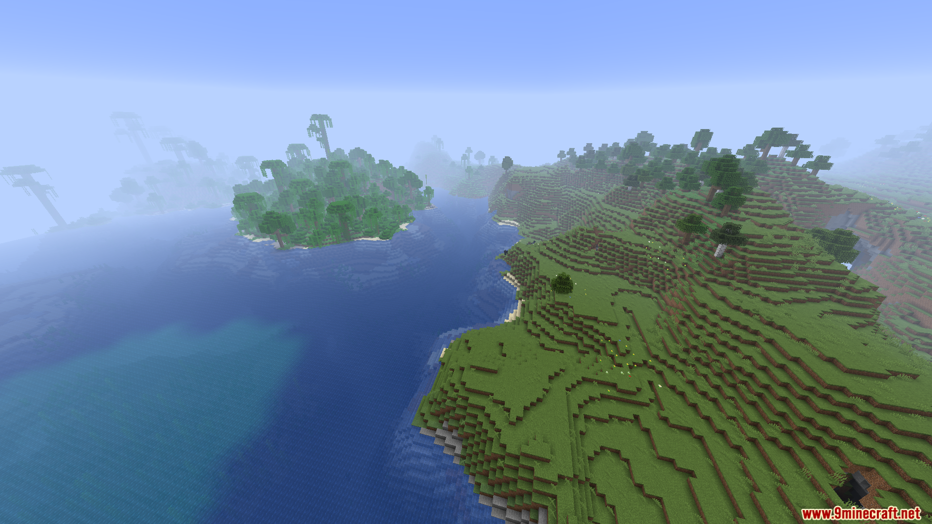 WorldWeaver Neoforge Mod Screenshot 10 A view of a Minecraft ocean with a jungle island and a grassy hill
