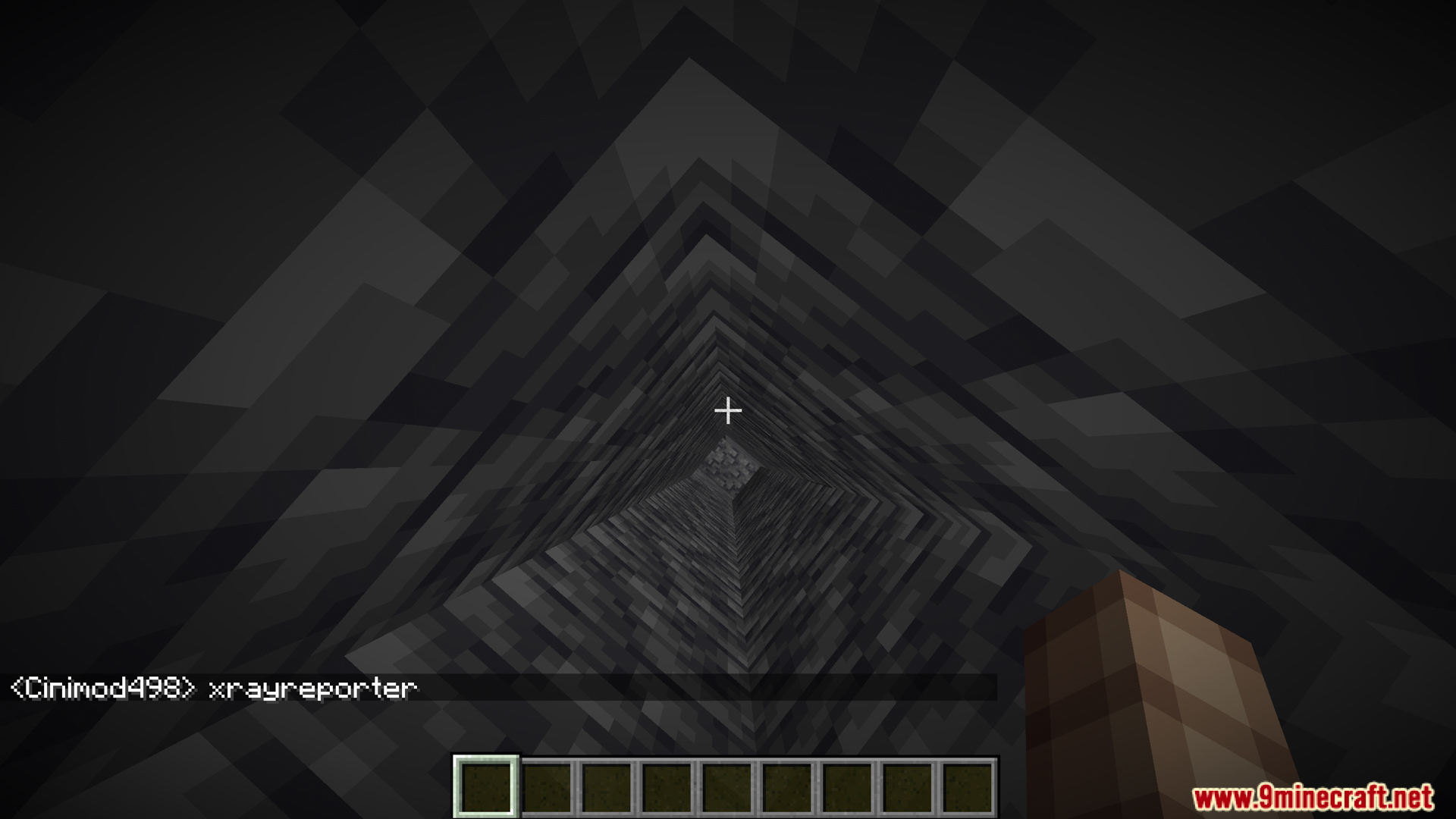 Player using the xrayreporter command while looking down a deep hole