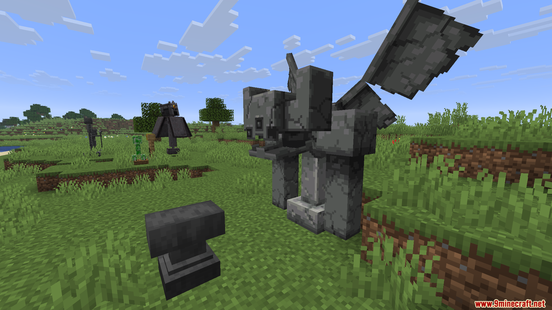 ALs Armor Stands Revamped Resource Pack Screenshot 11 A large stone gargoyle statue stands in a grassy field next to an anvil