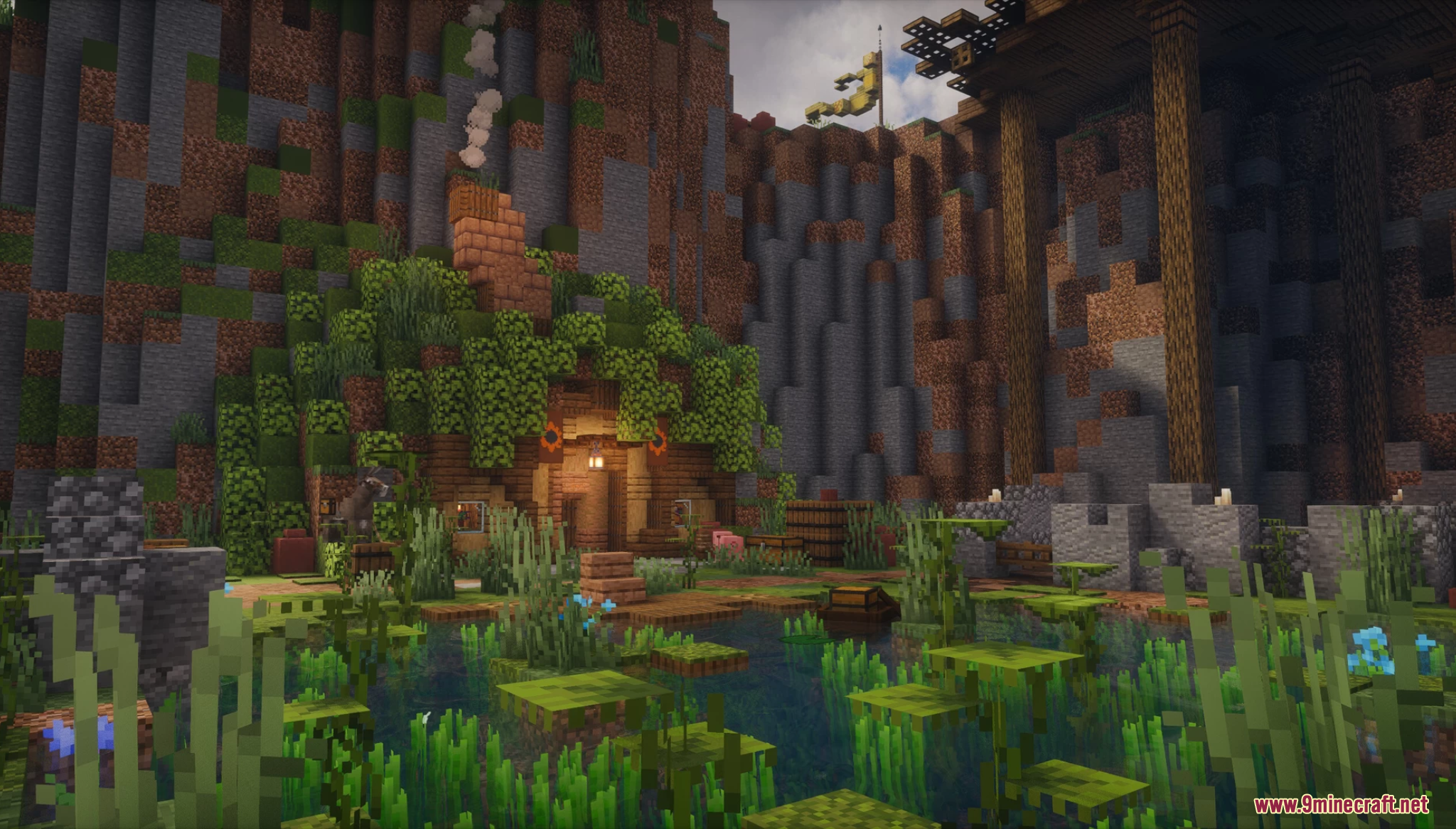 A cozy hobbit-style house built into a swampy cliffside