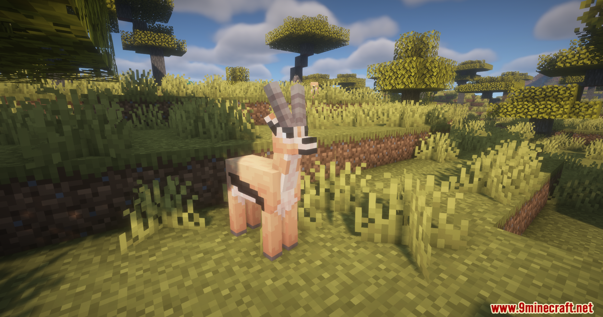Alex's Mobs Unofficial Port Mod Screenshot 8 A tan gazelle with striped horns standing in the grass in a savanna