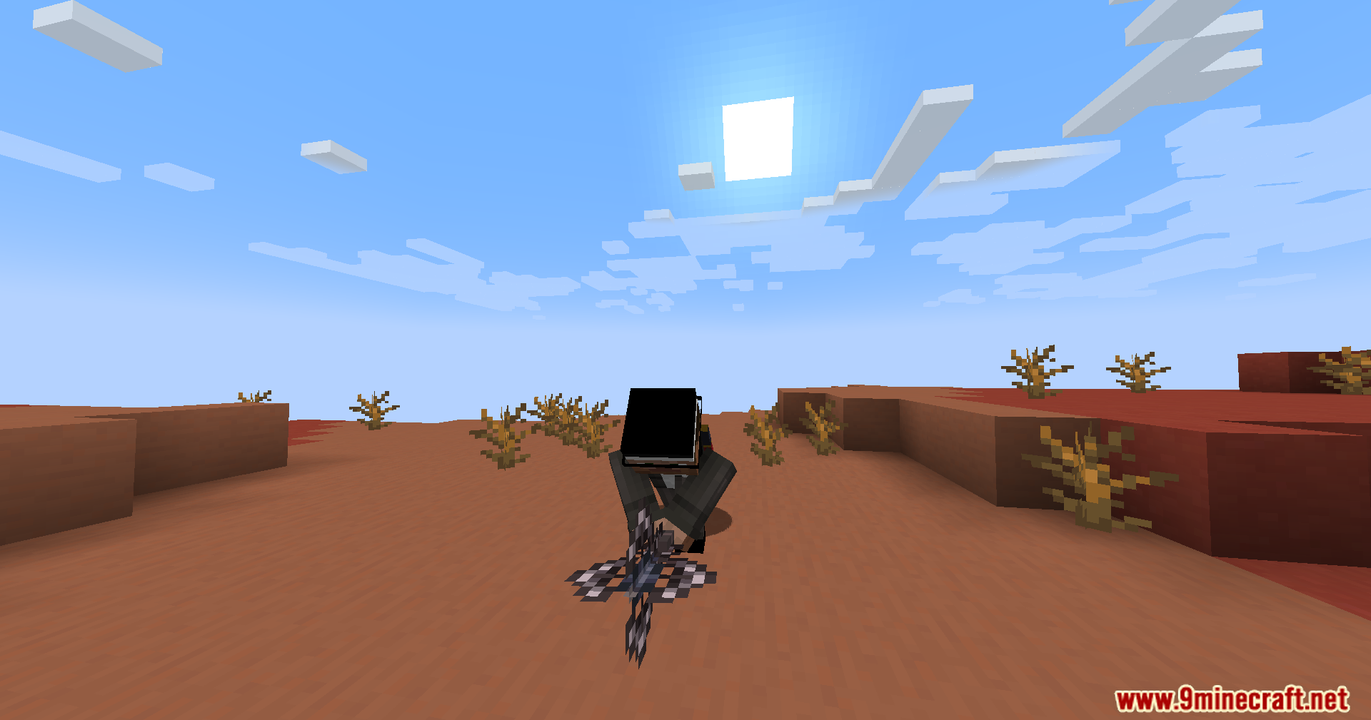 Player in a suit holding a complex magical weapon