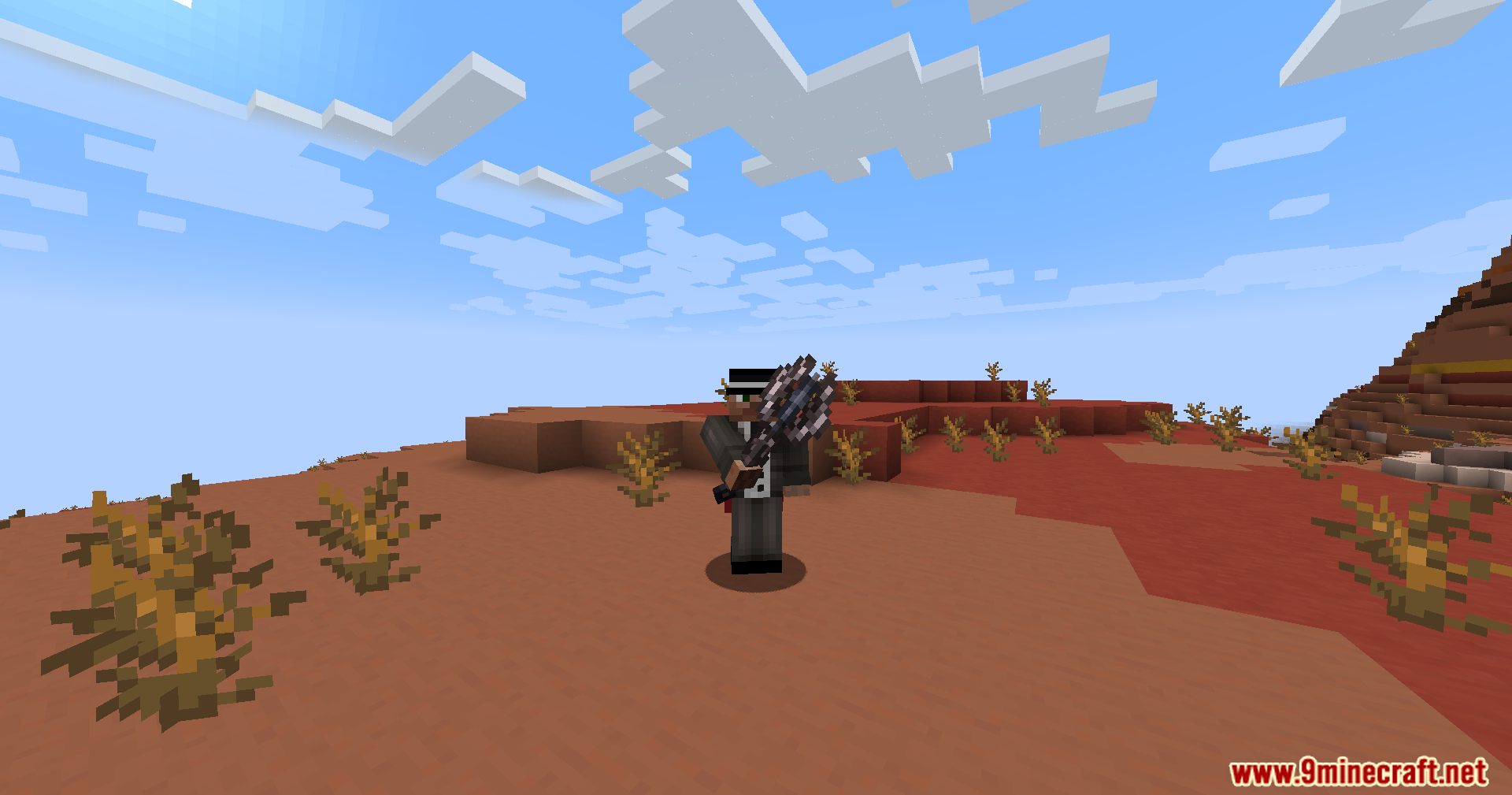 Character in a suit and fedora holding a weapon