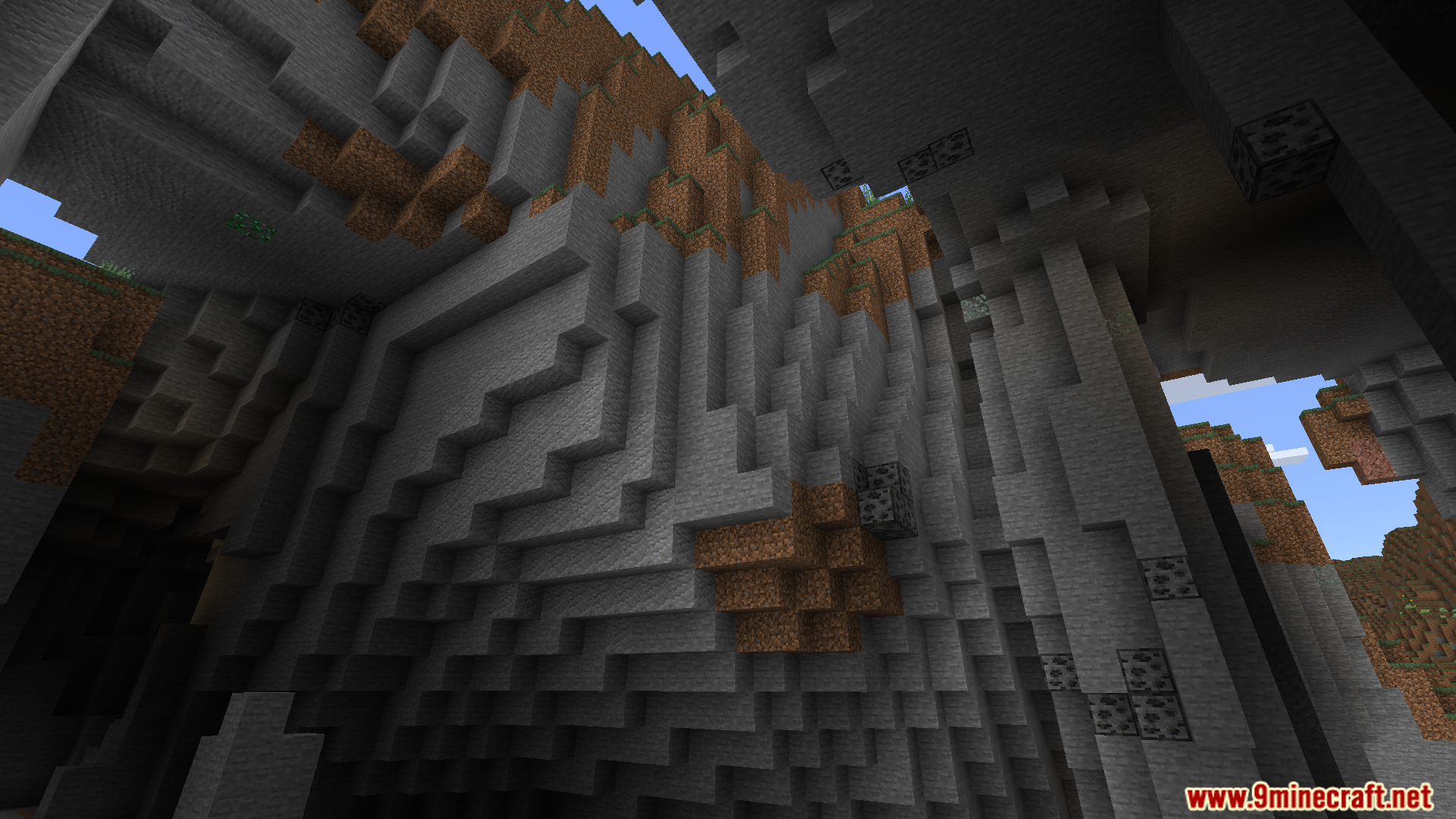 Brightly glowing coal ore is visible on high cave walls