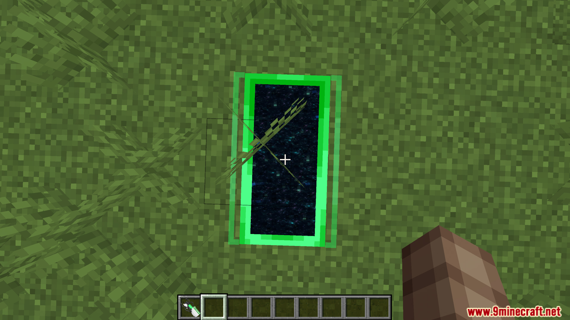 Looking down at a green portal on the ground