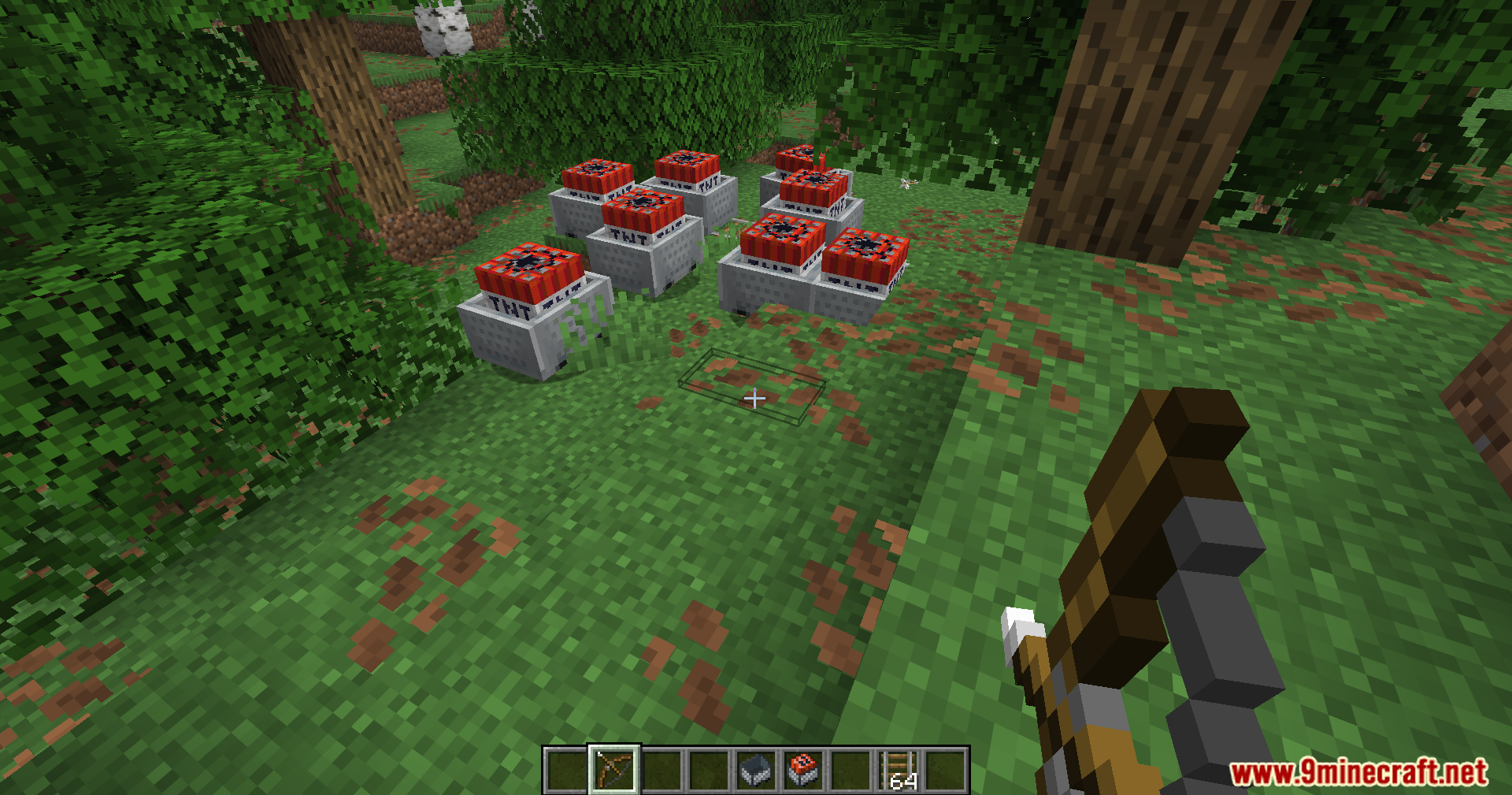 A group of TNT minecarts placed in a forest