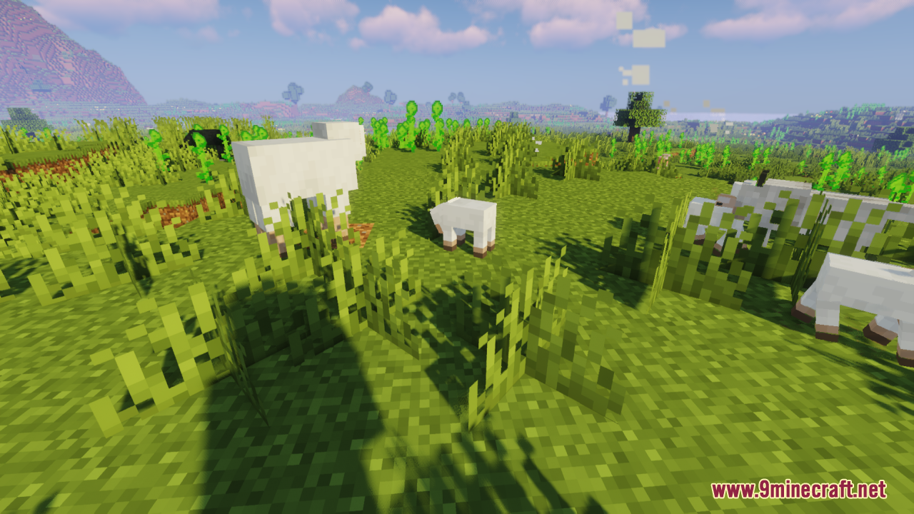 Baby Mobs Resource Pack Screenshot 11 A cute baby sheep stands near an adult sheep in a grassy field
