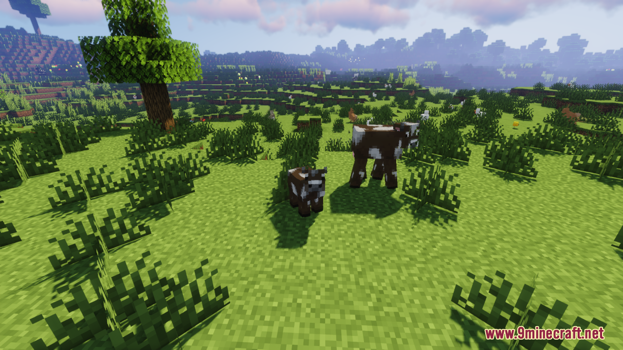 Baby Mobs Resource Pack Screenshot 5 Adult cow and baby cow standing together in a grassy Minecraft field