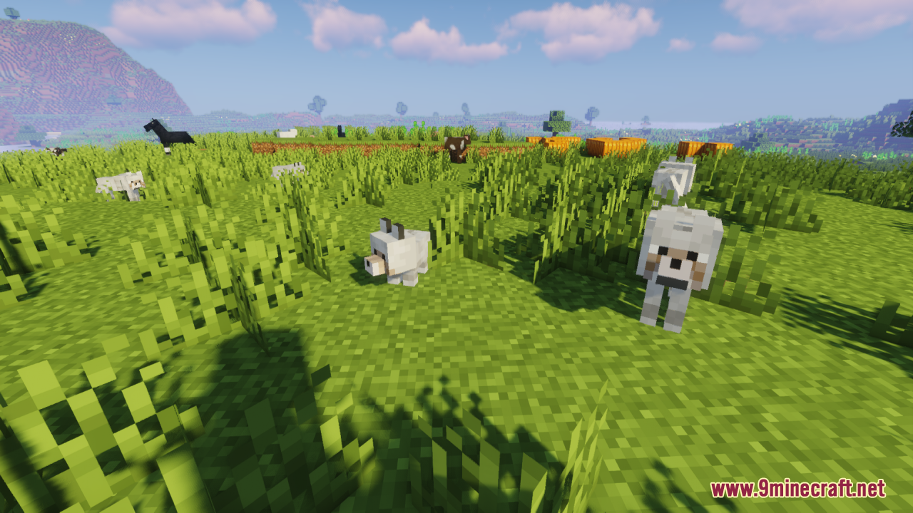 Baby Mobs Resource Pack Screenshot 9 Cute baby wolf standing in a grassy field with other animals nearby