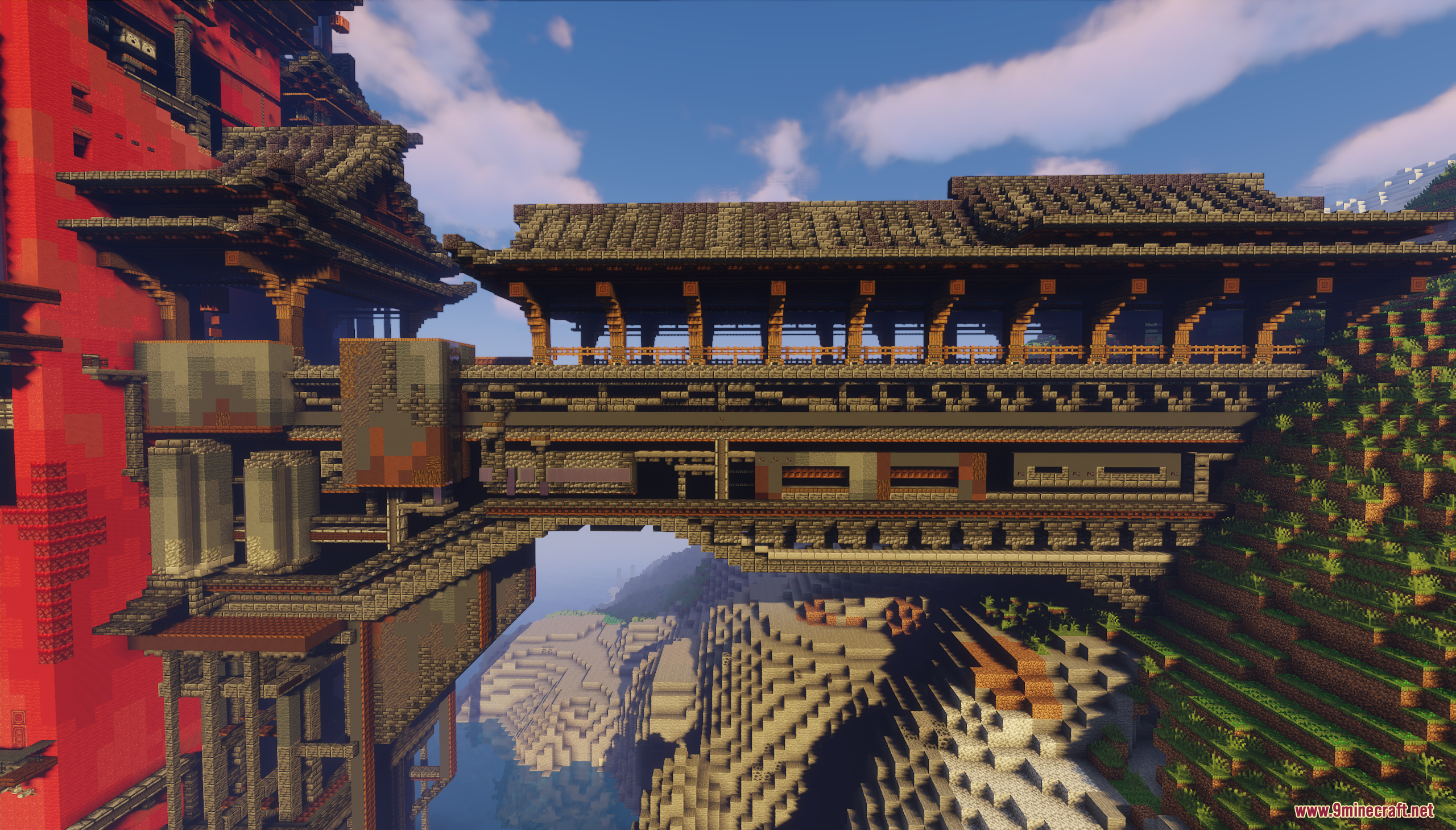 Large bridge connecting a cliff to the main red building
