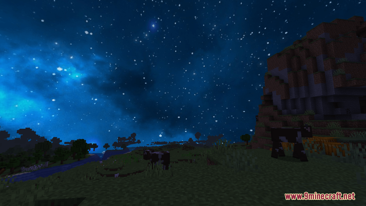 Cows grazing under a beautiful custom starry night sky with blue clouds