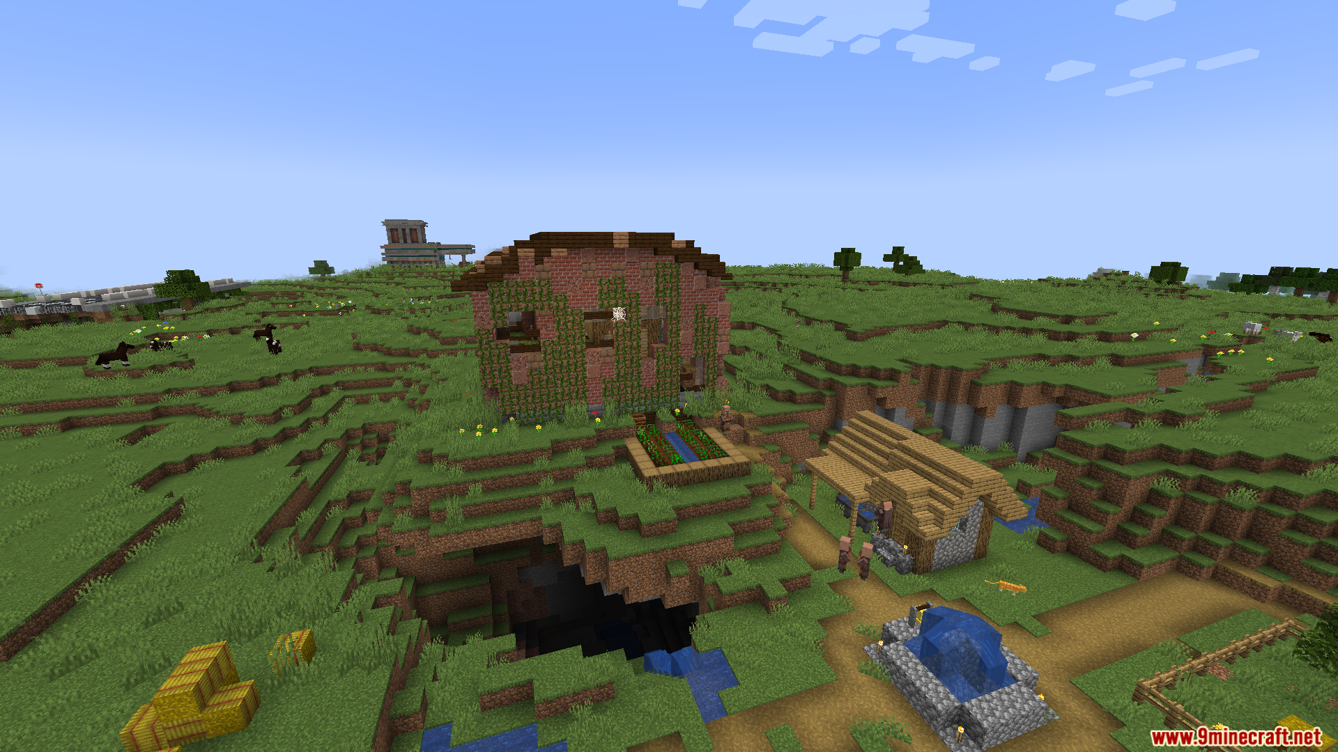 Overgrown ruined structures in a grassy Minecraft landscape