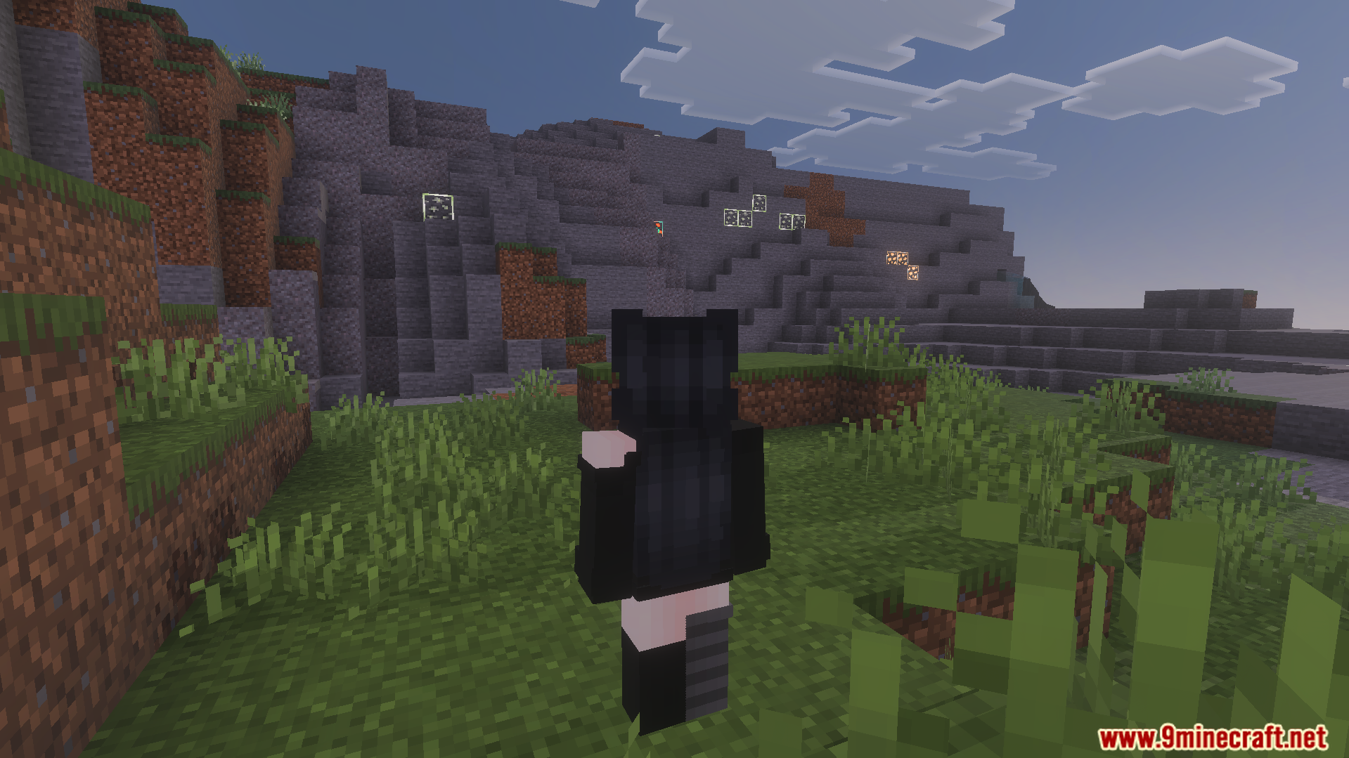 Player looking at glowing ores in a dark cave
