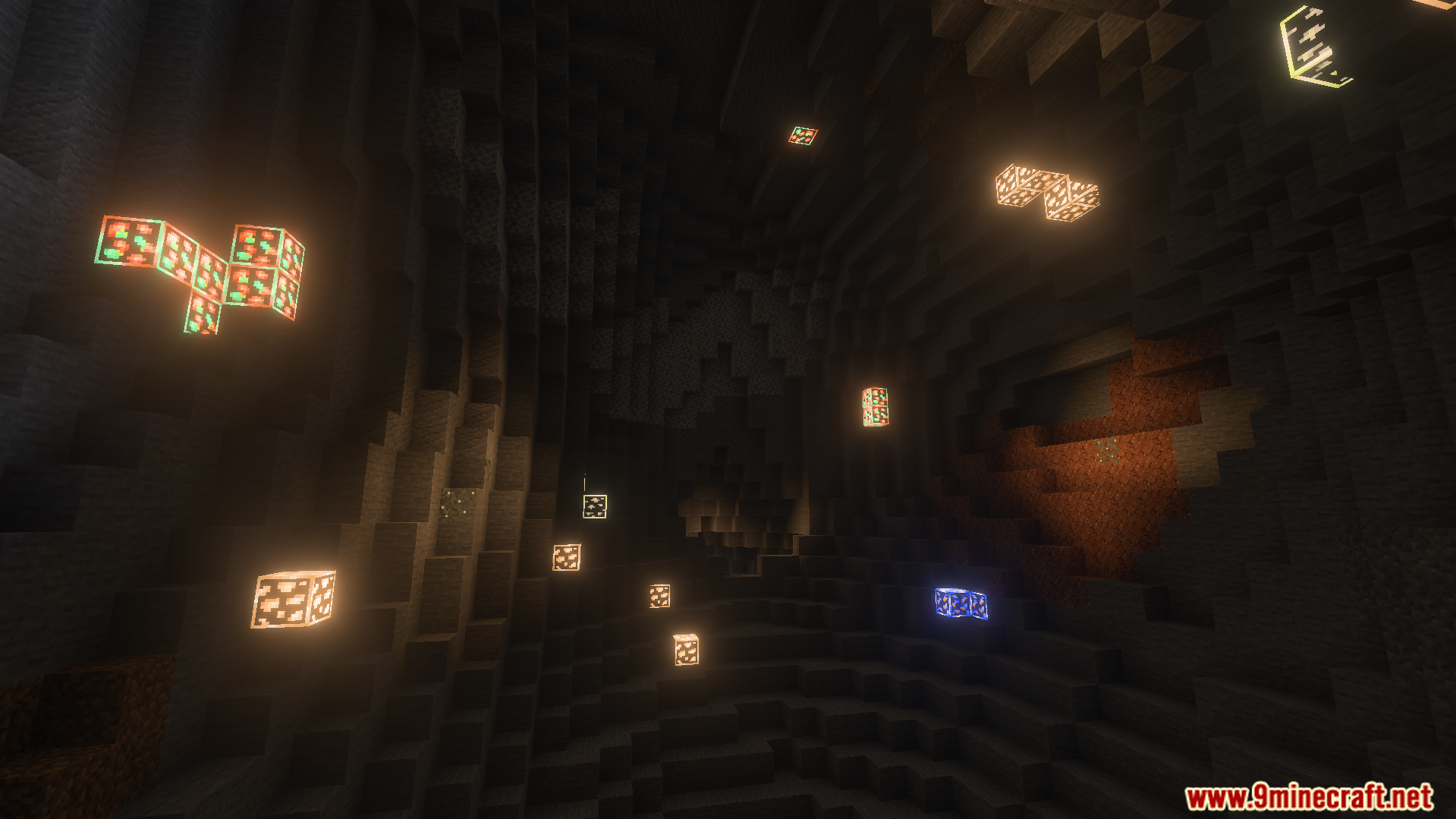 glowing ore blocks scattered across a dark cave wall