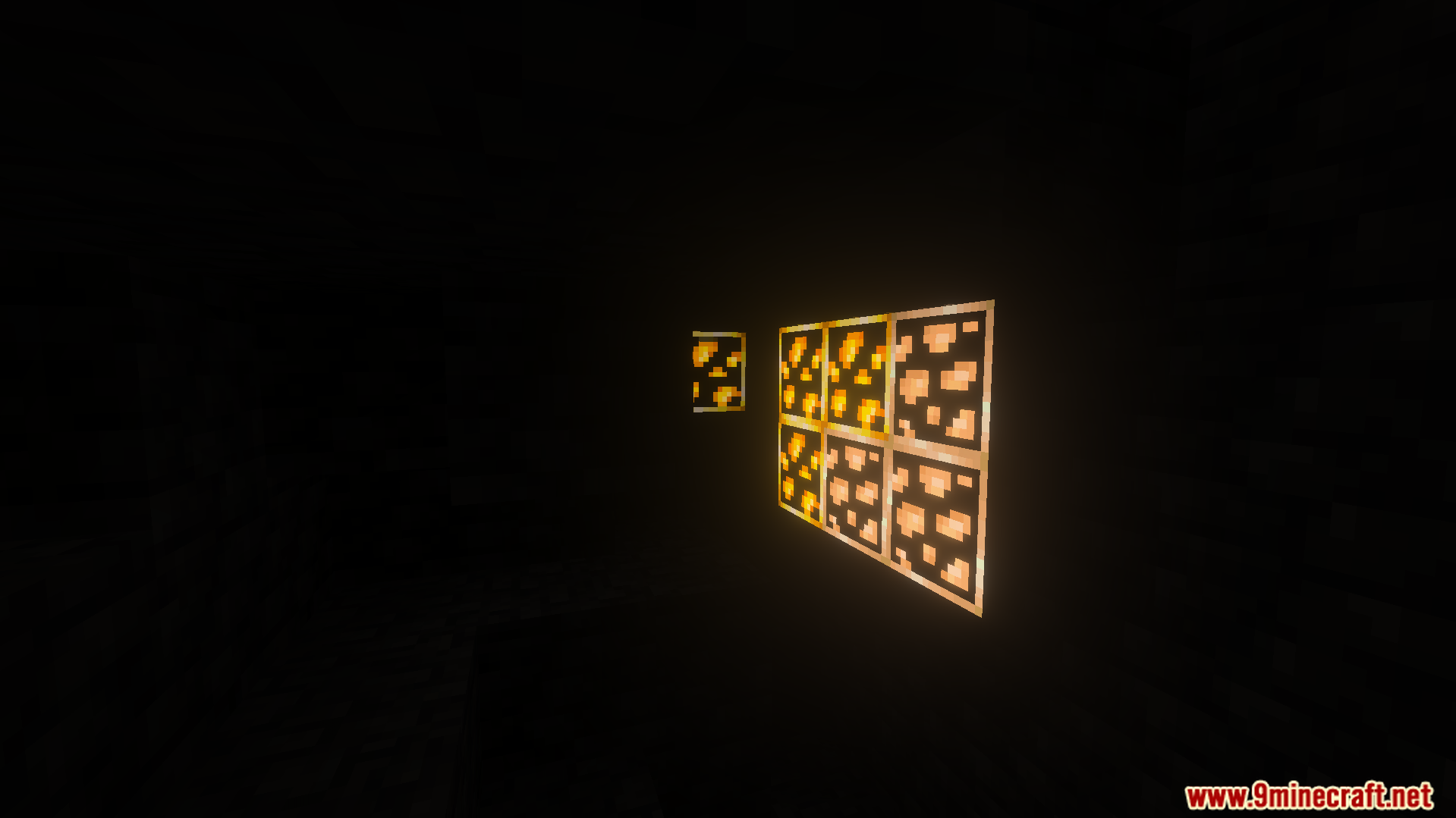 close up of glowing ore blocks in a dark cave