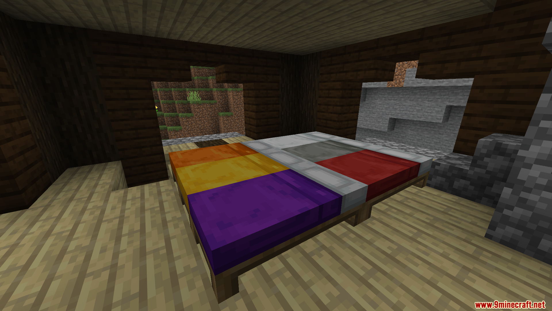A multi-colored bed inside a rustic wooden house