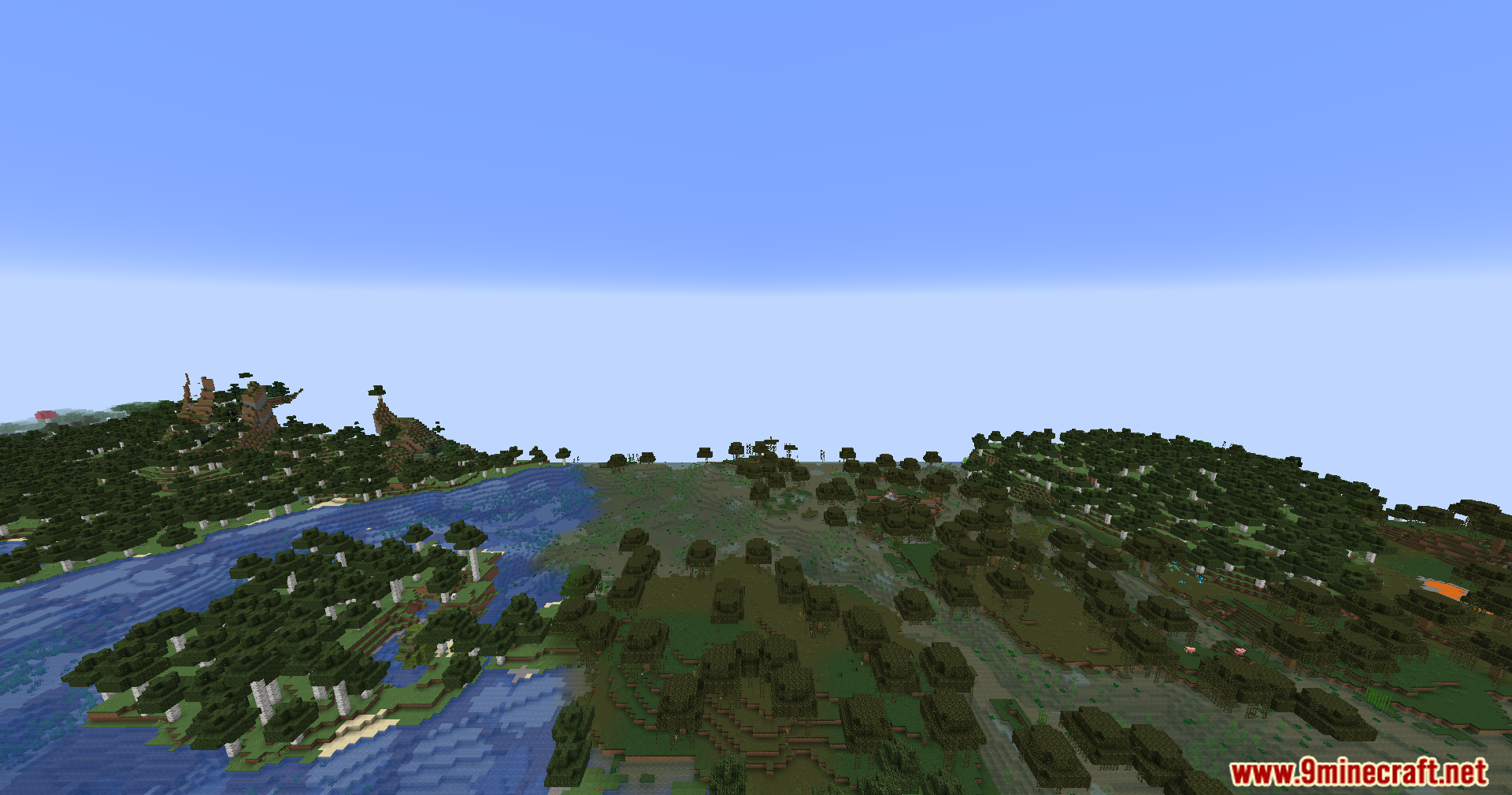 An expansive view over a flat, tree-covered swampy landscape