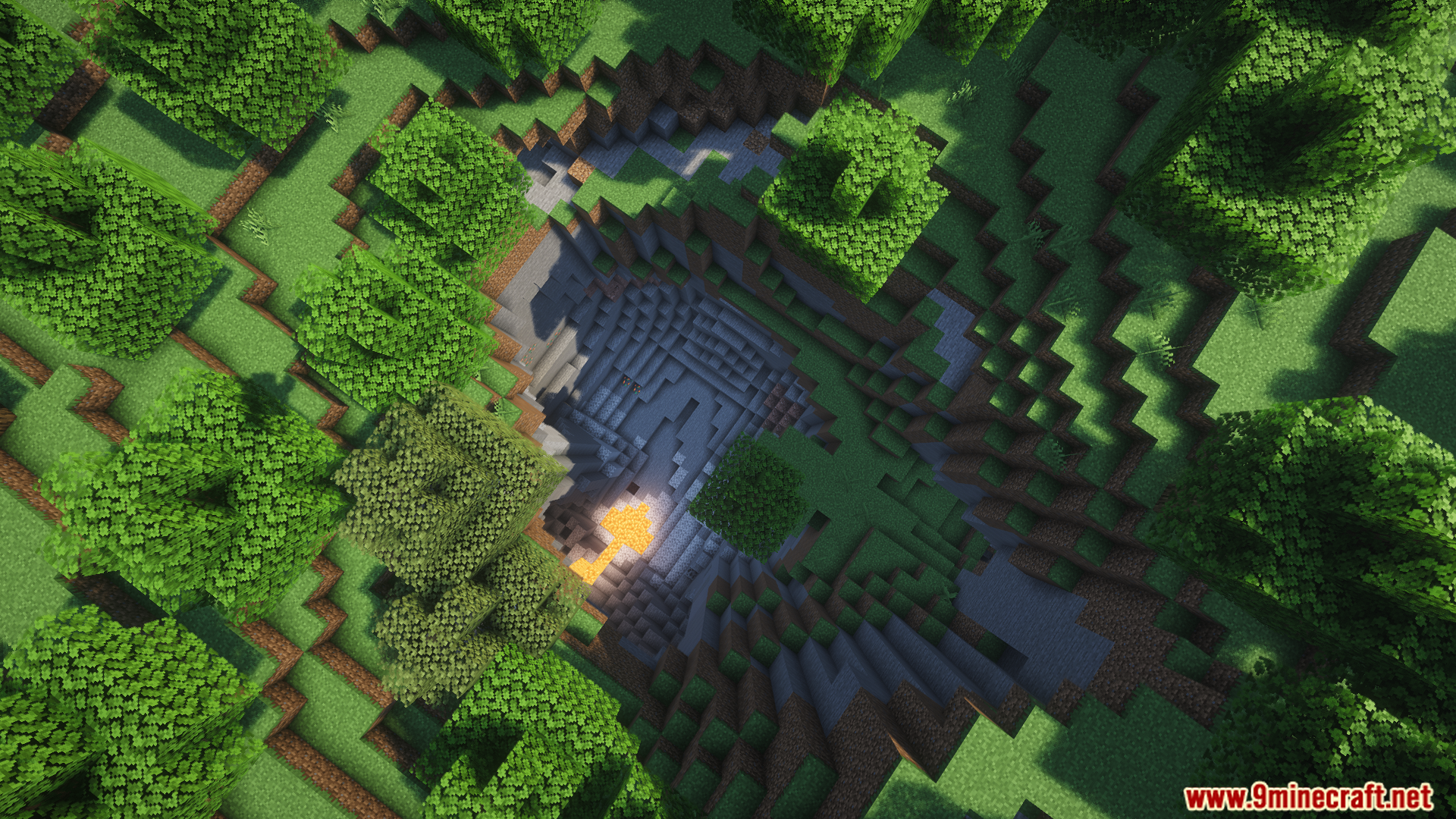 Aerial view of a deep crater with lava inside
