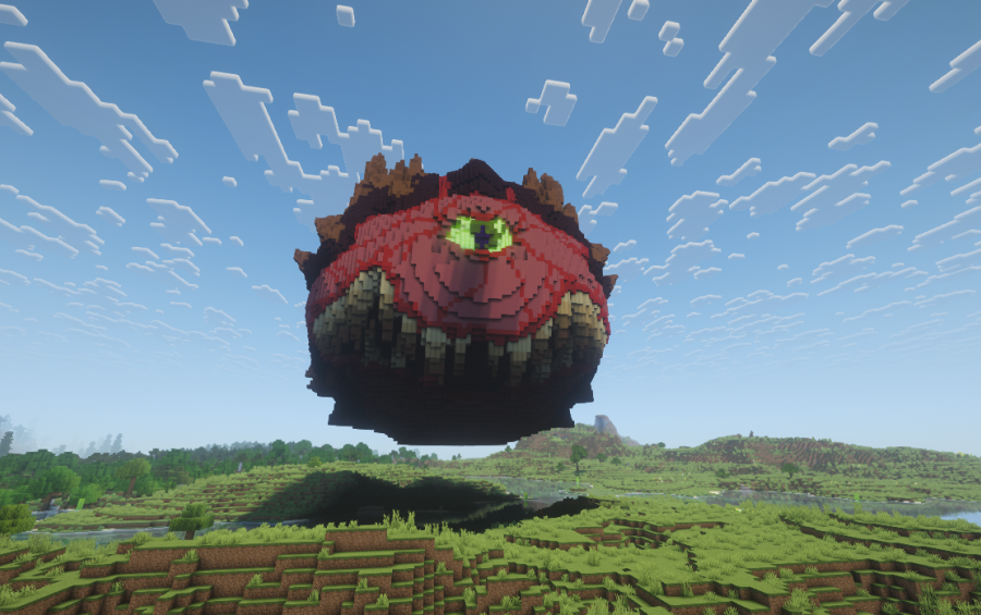 Massive red Cacodemon statue floating in the sky above a green grassy field