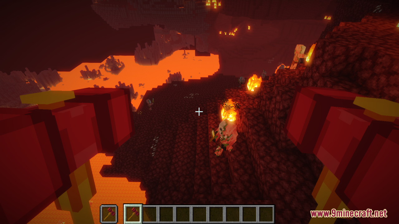 First person view holding the red and yellow hammers in the Nether