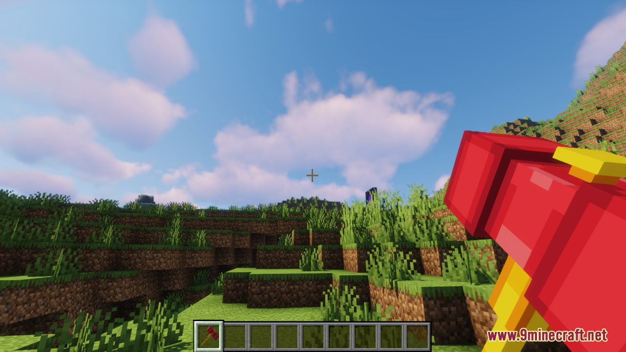 Player holding the custom red and yellow hammer in first person view