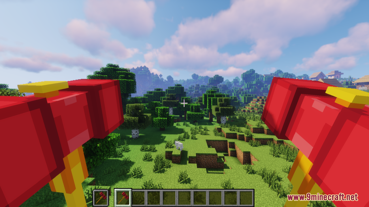 First person view of a player holding two red and yellow hammers