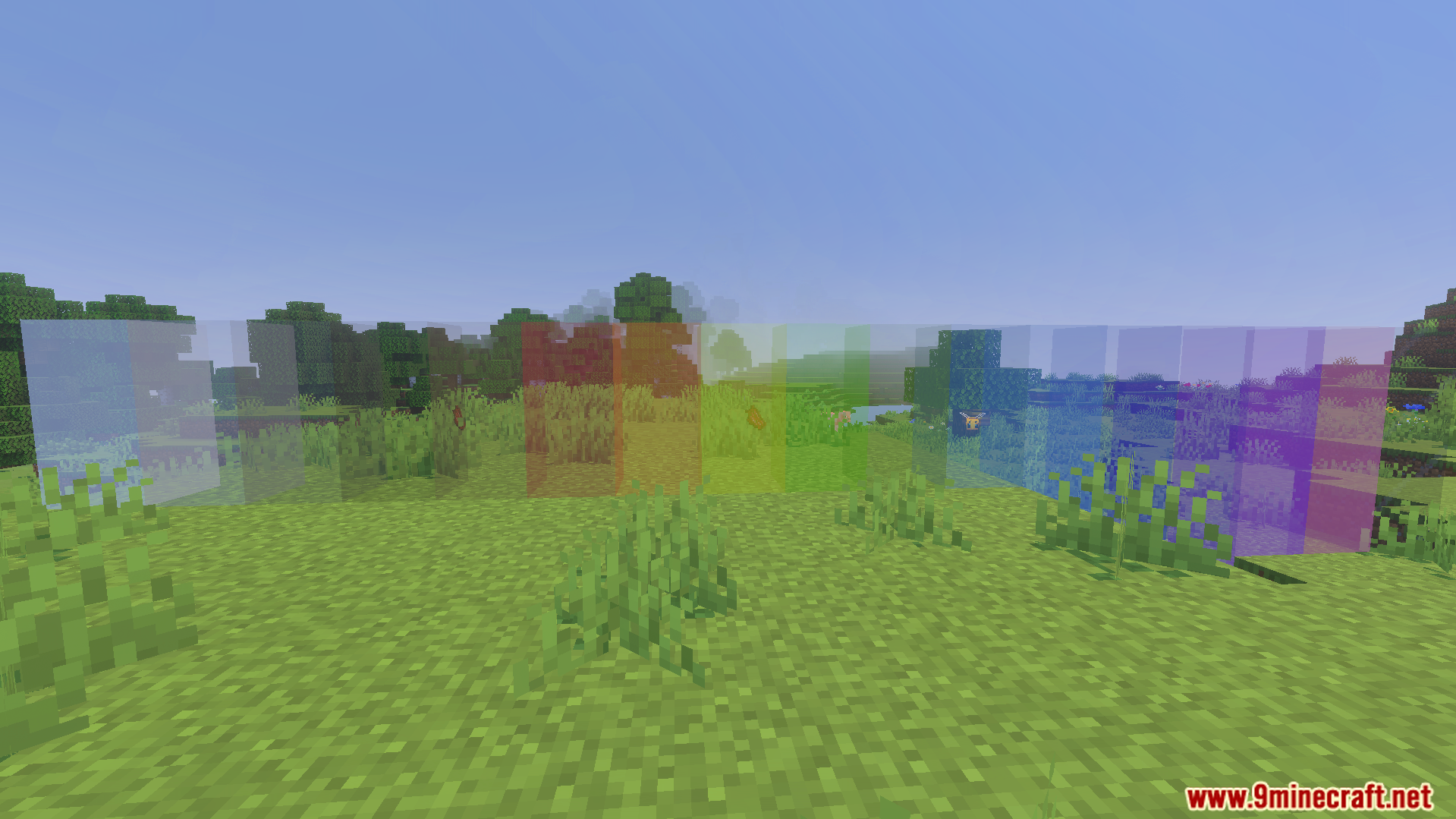 Clear Glass Texture Pack Screenshot 4 A row of various colored clear glass blocks in a grassy field