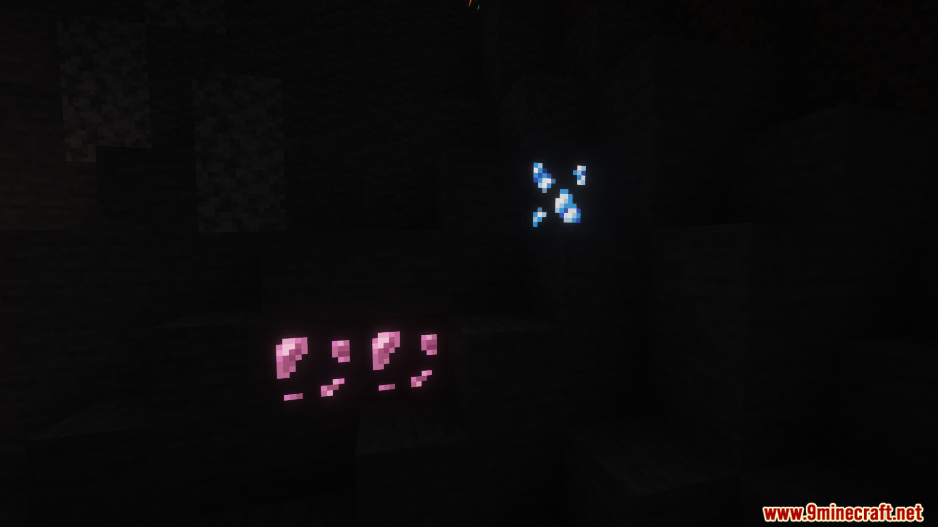 Pink and blue glowing ores in a pitch-black cave