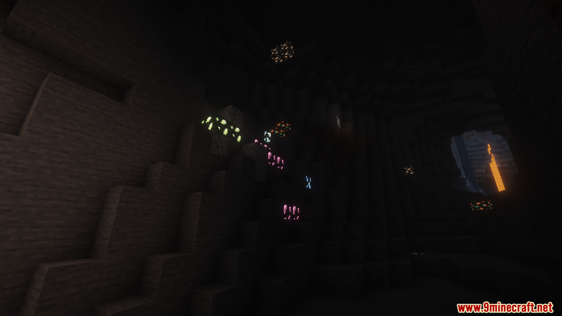 A dark cave system with various glowing ore veins