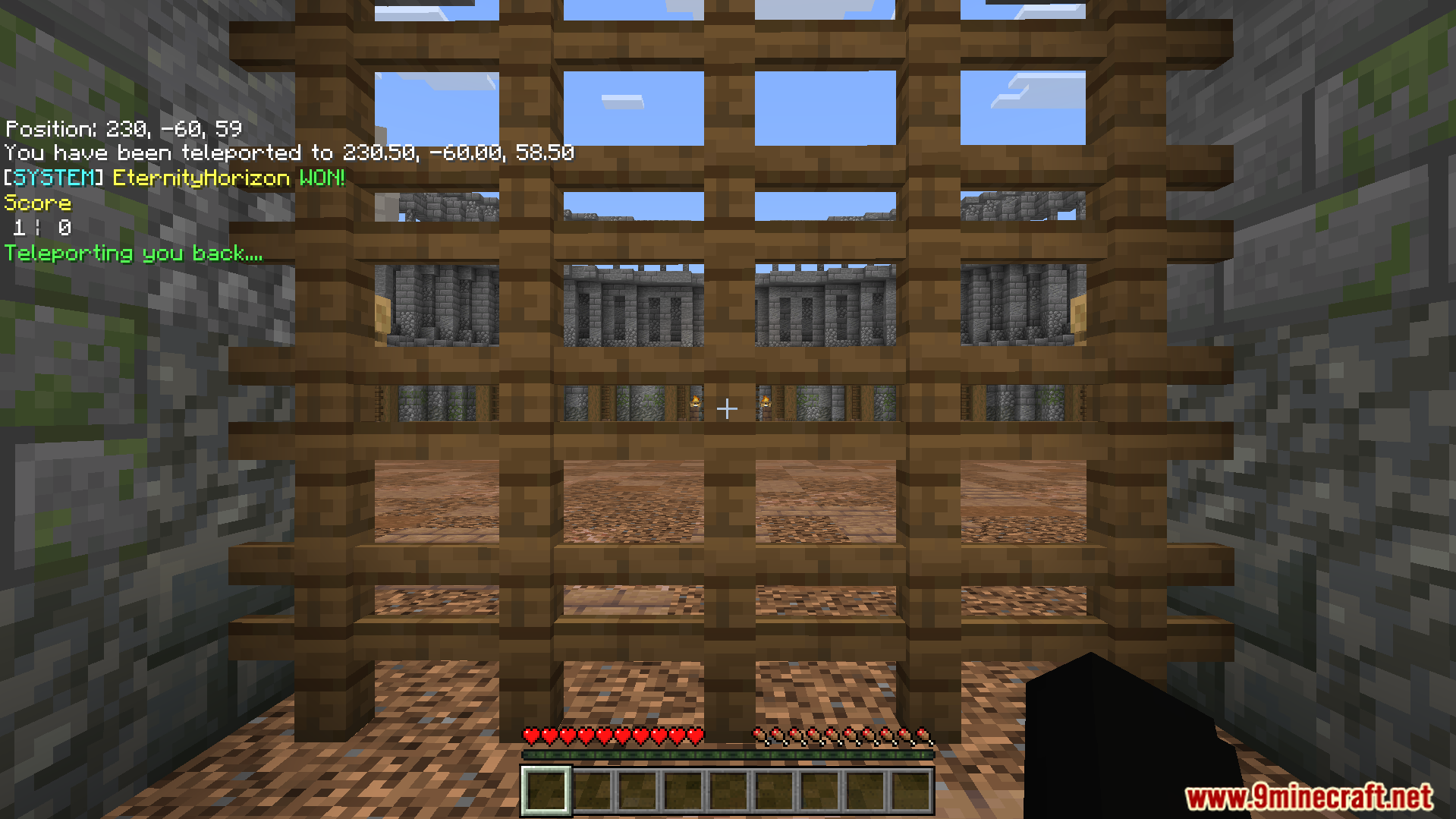 A player looks through a gate into the castle battle arena