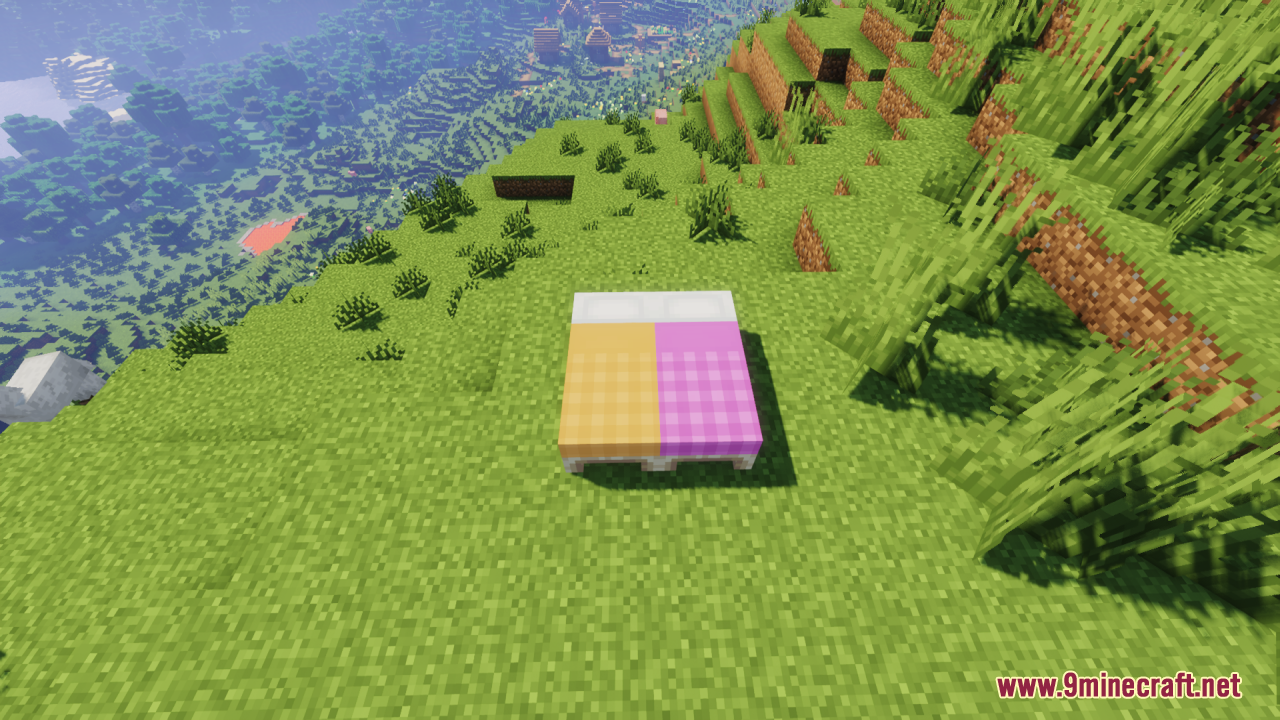 Cozy Nook Beds Resource Pack Screenshot 13 Orange and pink plaid patterned beds placed on a grassy hill