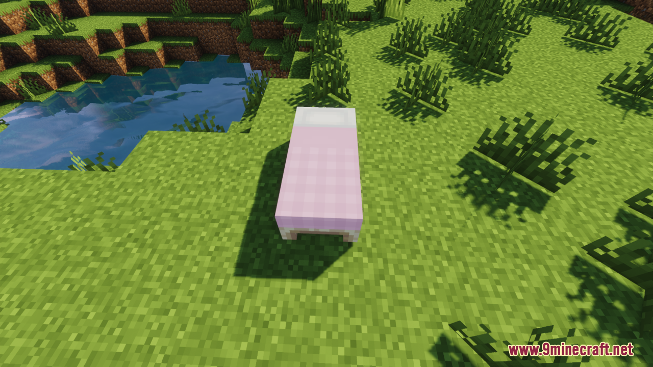 Cozy Nook Beds Resource Pack Screenshot 2 A single pink plaid bed placed on grass near water